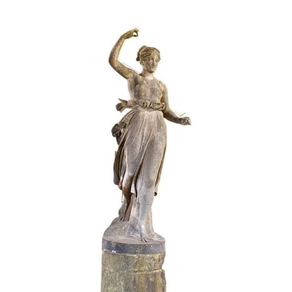 A beautiful carved white marble figure of Hebe, gliding on her original stone pedestal, from the 2nd quarter of the 19th century. The figure itself is 165cm and including the pedestal it is 250cm, making it a stunning sculpture. circa