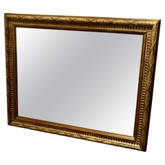 A Large Carved Oak and Gilded Wall Mirror  A very unusual piece