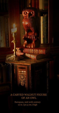 A Large Carved Walnut Figure of an Owl