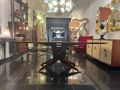 A large cherrywood dining table by Melchiorre Bega