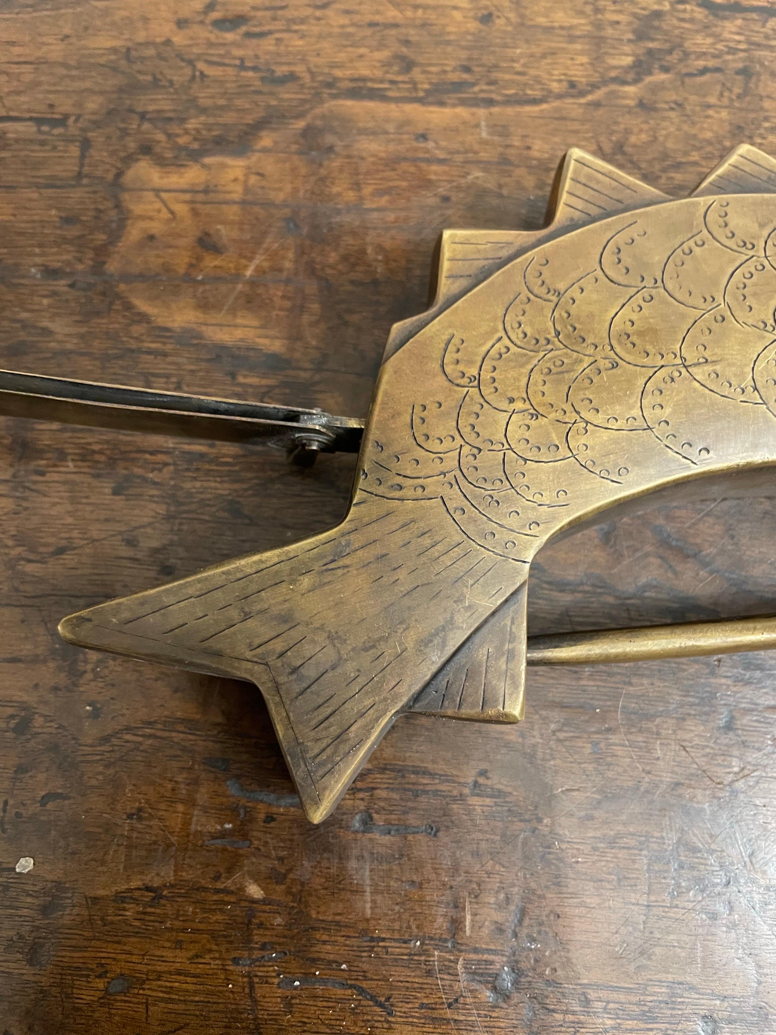 A Large Chinese Brass Fish Lock with Key, Early 20th Century

Provenance: Private Perth Collection.

Dimension: Width: 20cm Depth: 10cm Height: 3cm.

Note: The lock is not in working condition and needs to be repaired to work.