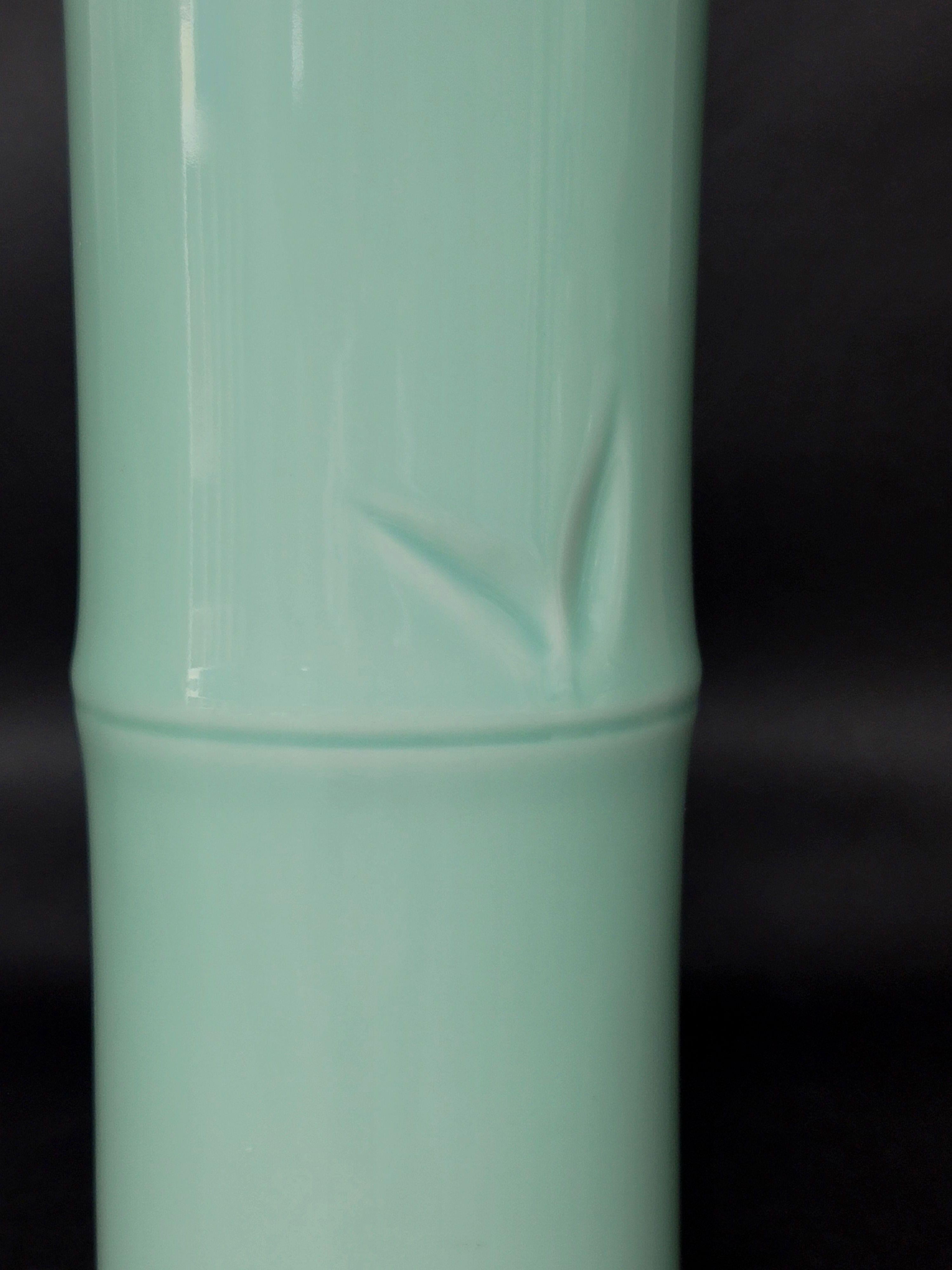 A large Chinese Celadon glazed bamboo hat vase, depicting the light celadon color with two bamboo leaves presenting in a way of clean and elegant character in the Chinese scholar personality. 
The so-called hat vase is that it serves as a table