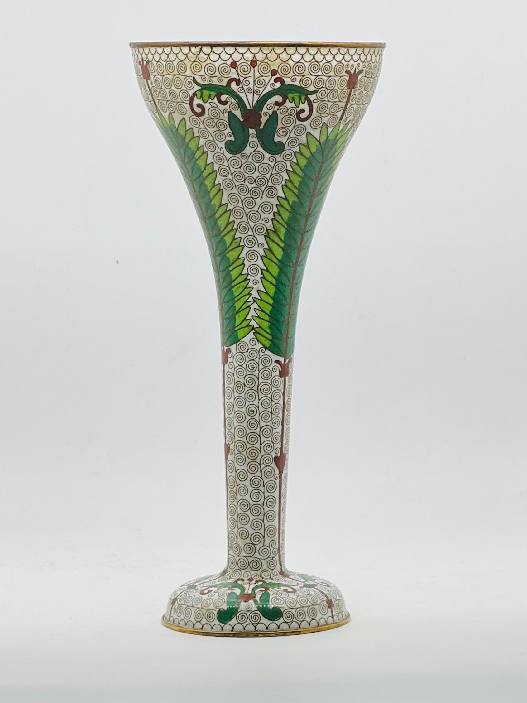 
A Large Chinese Cloisonne Enamel Trumpet Vase.


Early 20th Century -Republic period


Worked in silver wire and decorated with flowers and vines on a white ground, gilt rims .


In very good condition. No damage or restoration.


Size: H-29 cm,