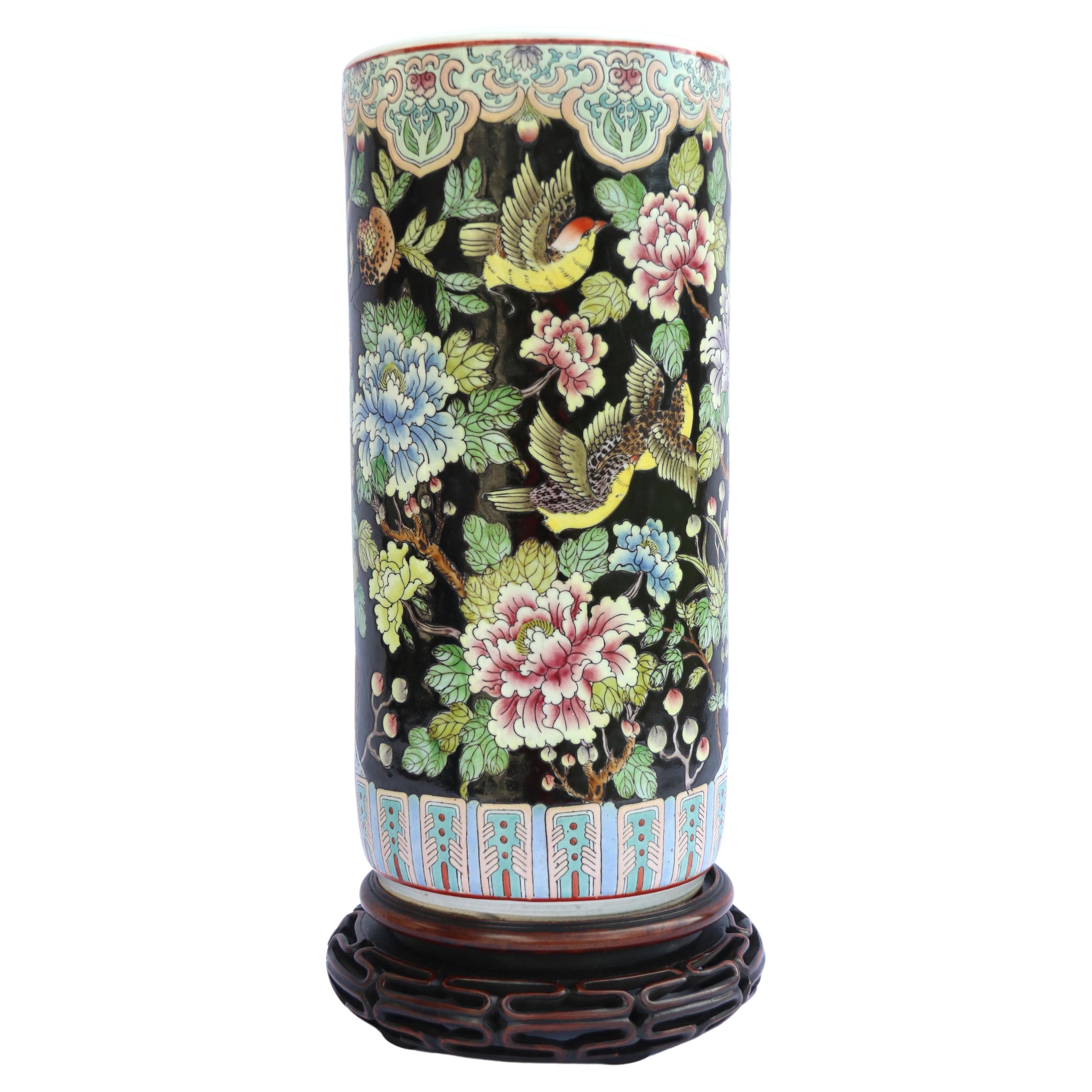 A large Chinese famille noire porcelain vase and original hardwood stand. For Sale