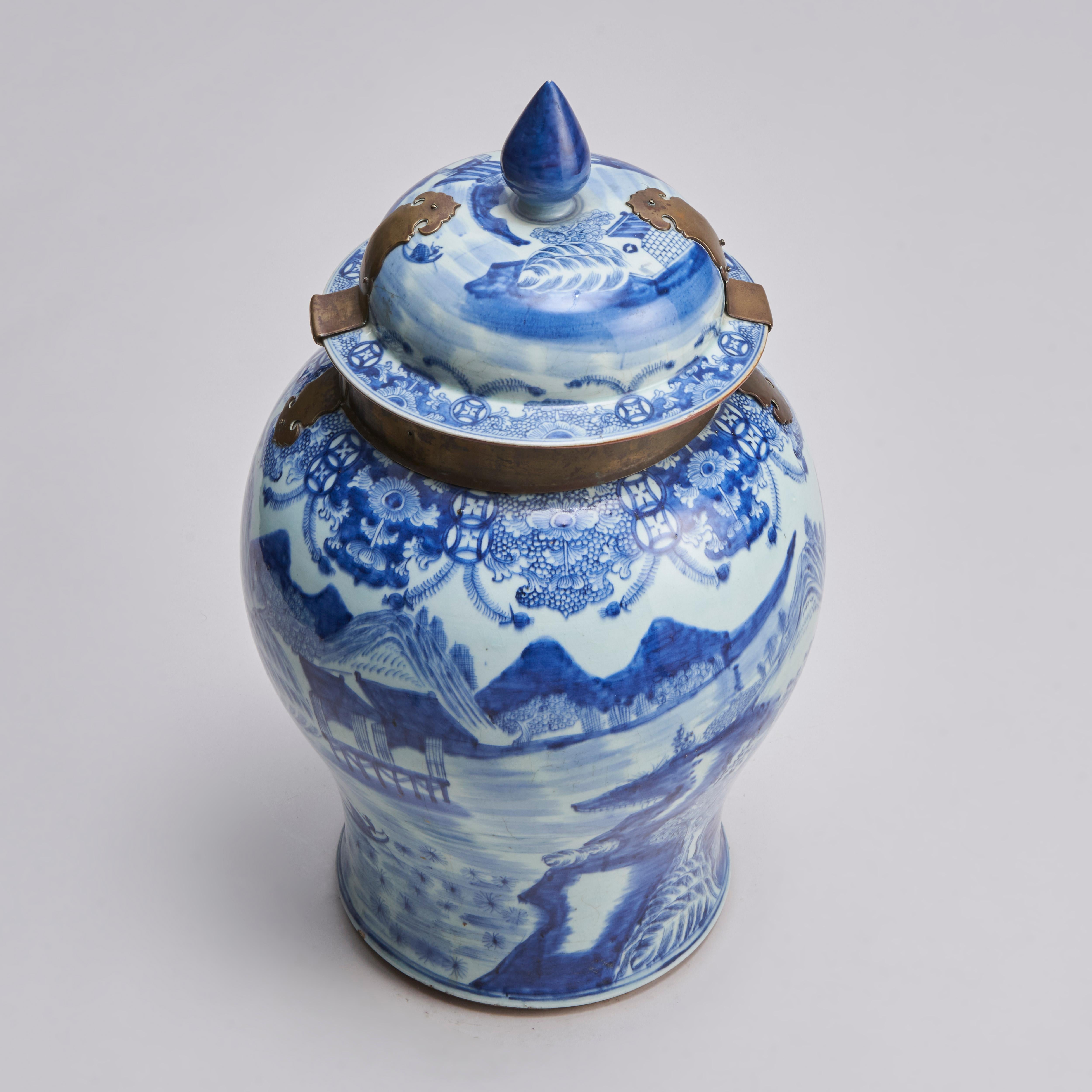 A large 18th century Chinese blue and white temple jar and cover, with original brass collar and lock.This would have been used to secure valuable spices as some were worth more than their weight in gold, (or porcelain even.) The vase itself is