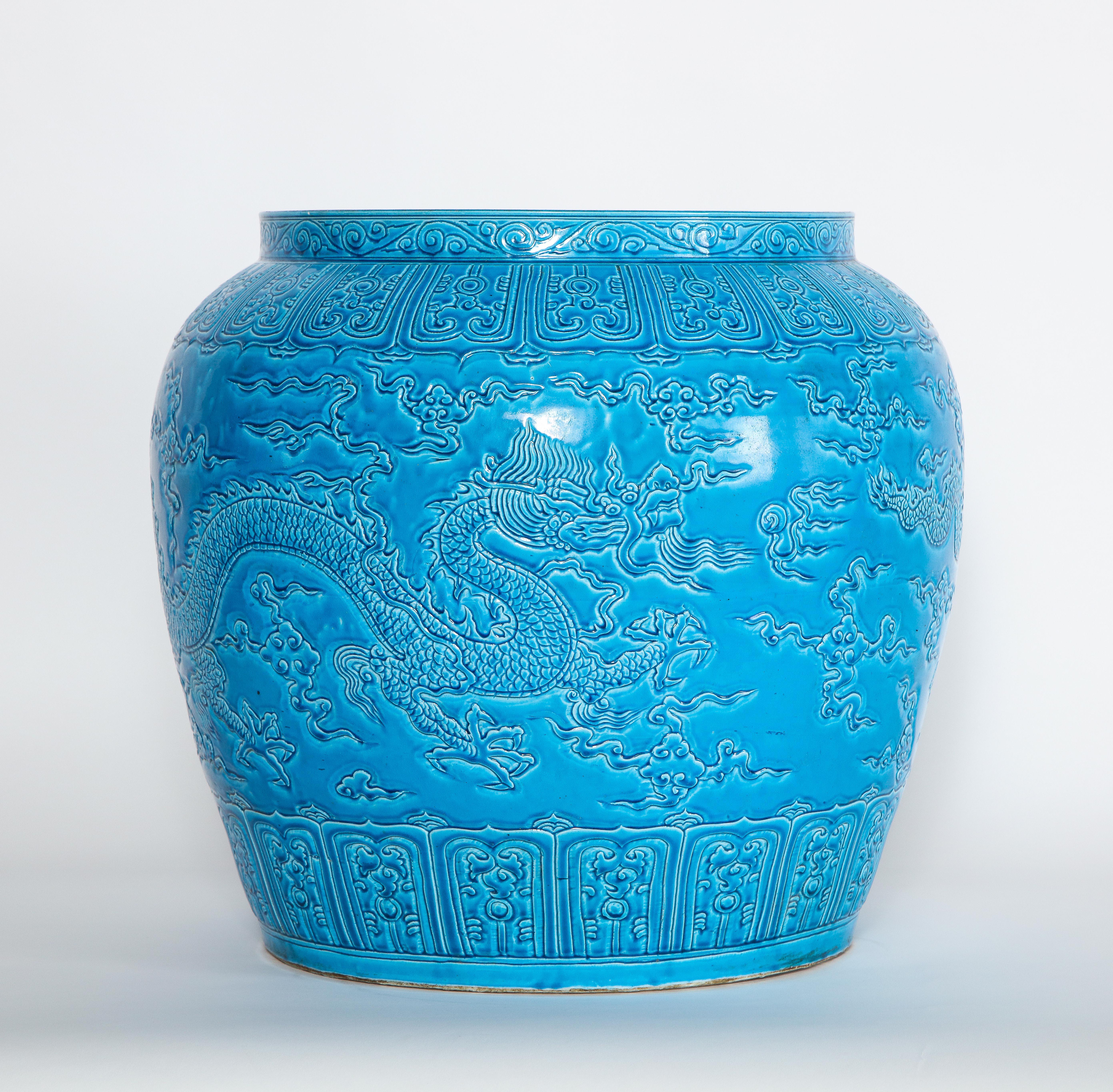 A fabulous and large Chinese 19th century turquoise blue ground five-claw dragon planter/jardinière. Beautifully hand carved, this Chinese planter expresses imperial quality, as only the emperor could have a five-claw dragon object made for him. The