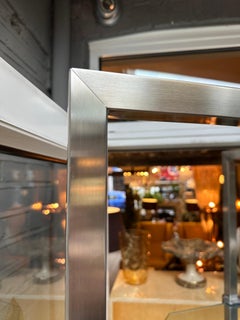 A Large Chrome Adjustable Glass Shelved Corner Etagere By Peter Ghyczy