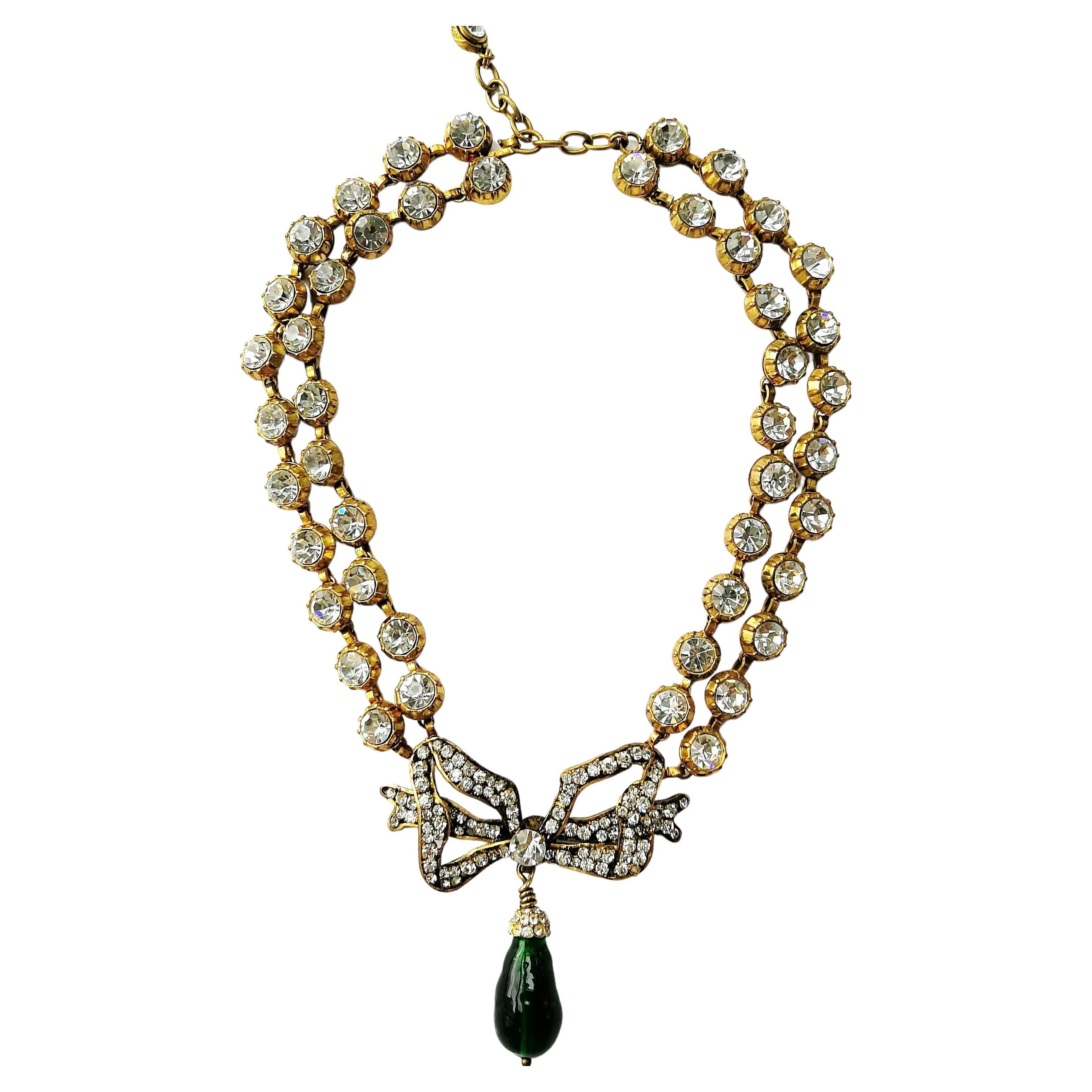 A large clear paste, emerald poured glass 'bow' necklace, Chanel, France, 1980s