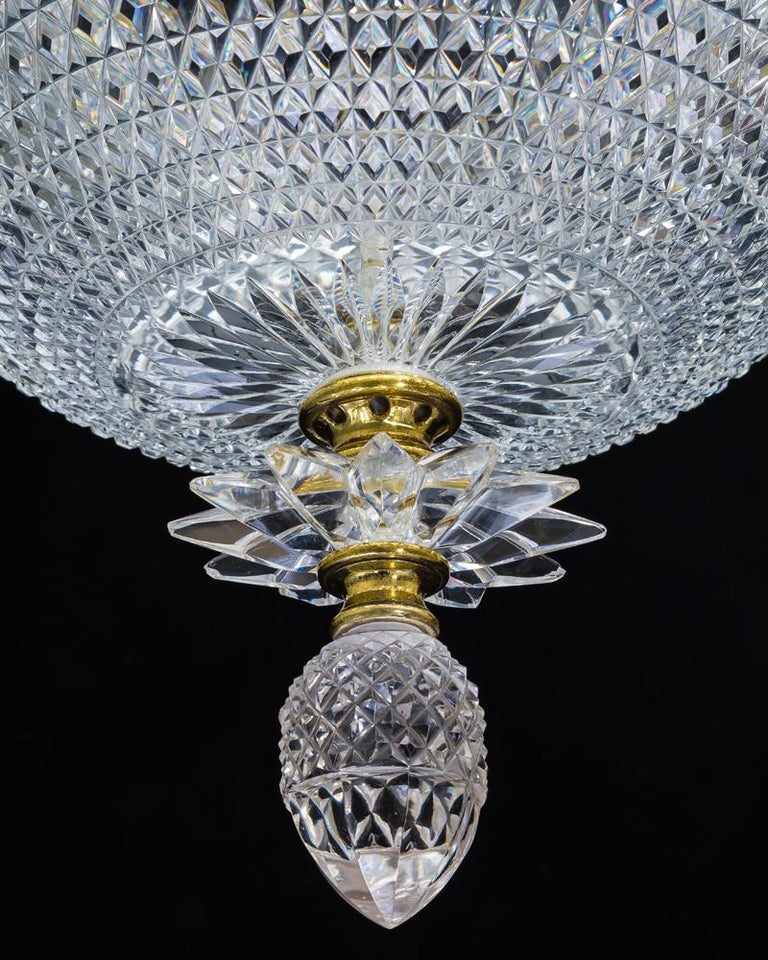 A cut glass gilt mounted plafonier by F. & C. Osler with split diamond cut bowl issuing a cut glass star and pine cone finial, the metal stamped F&C OSLER.