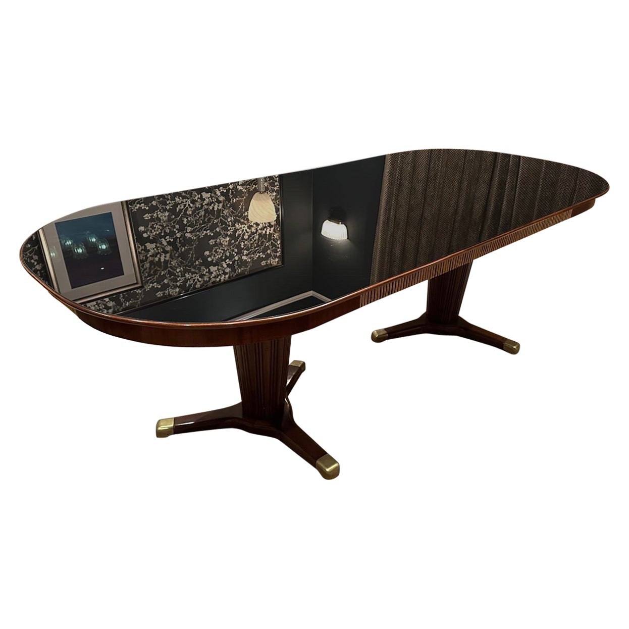 A large dining table by Melchiore Bega