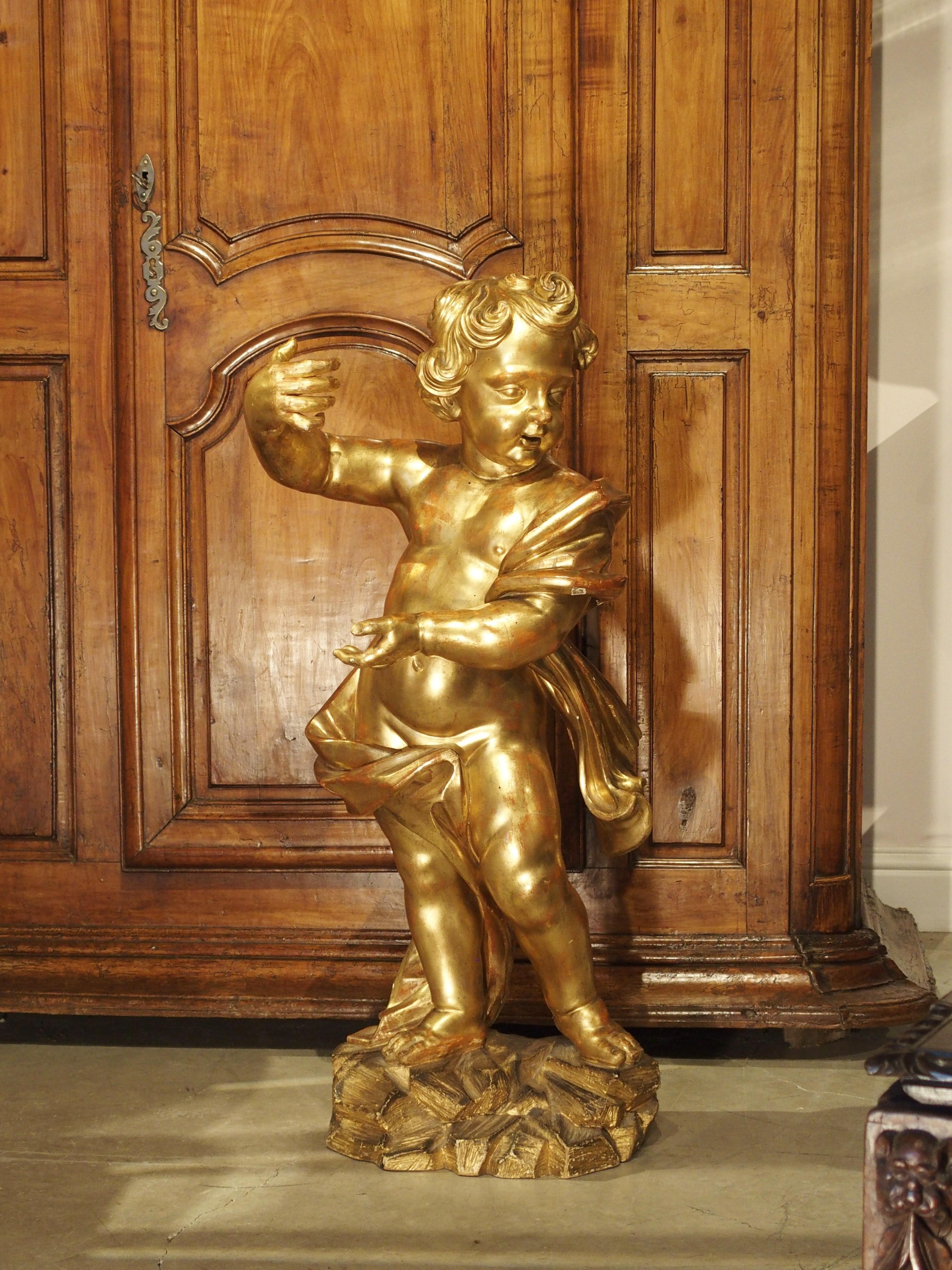 gold cherub statue