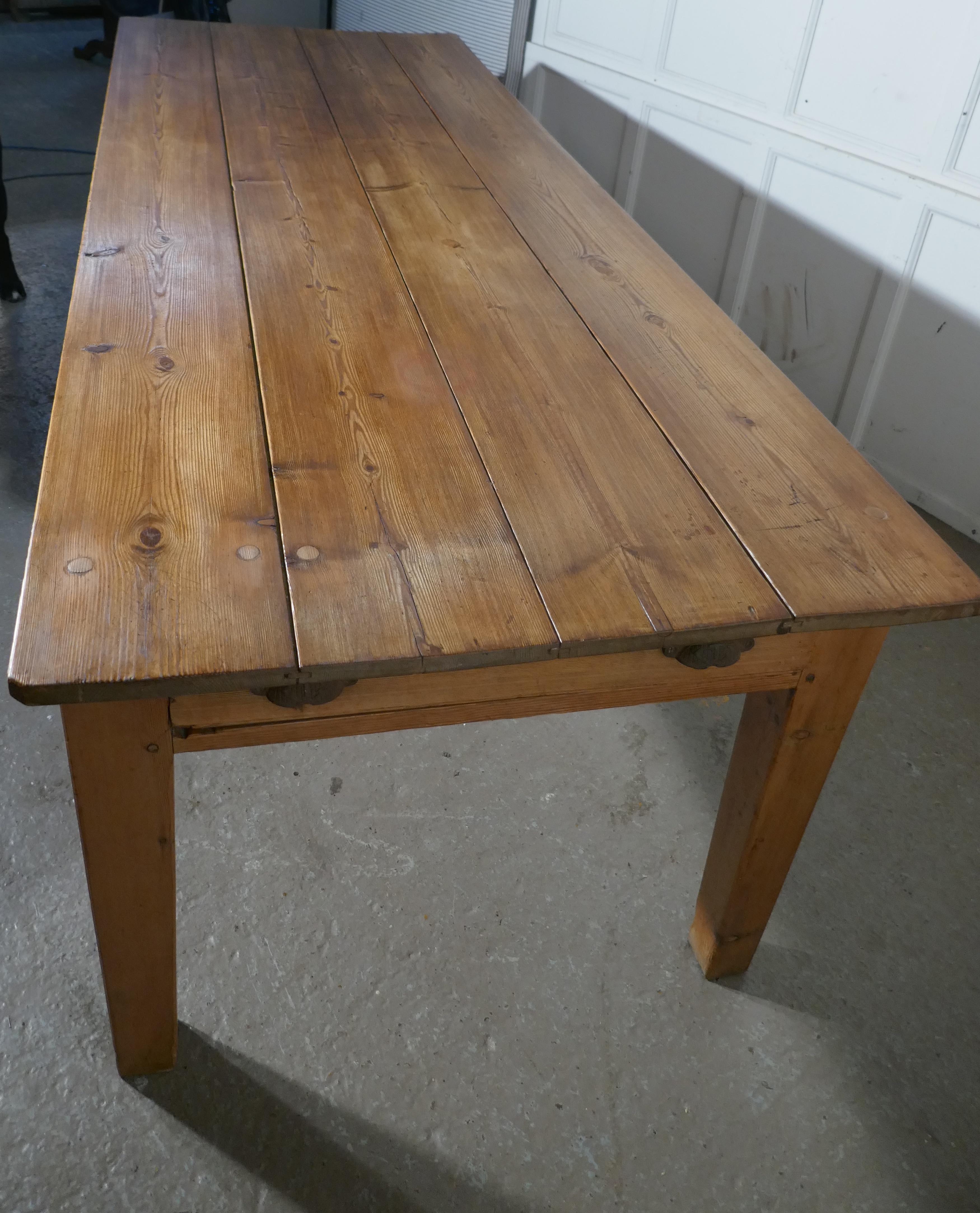 A large early 19th farmhouse pine table

This is good honest farmhouse table and it is an unpretentious piece is naturally aged with a delightful patina 
The top of the table is made from 4 long pine planks and there is a large drawer in each