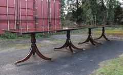 A large early 20th Century mahogany four pedestal dining table