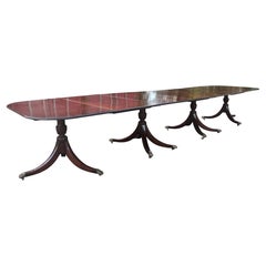 A large early 20th Century mahogany four pedestal dining table