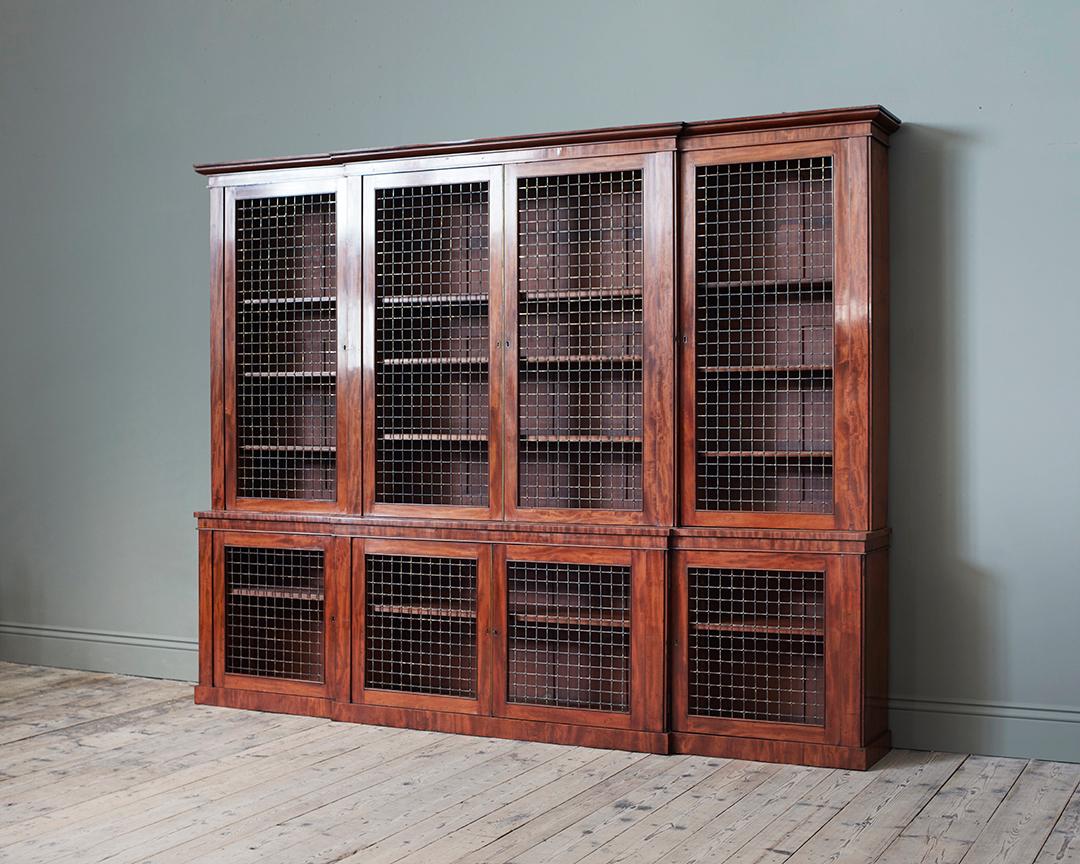With stepped and moulded cornice above grilled doors enclosing adjustable shelves, the base with further grilled doors, with adjustable shelves. Stamped M Willson.

Further Literature: “Dictionary of English Furniture Makers 1660-1840″; Thomas