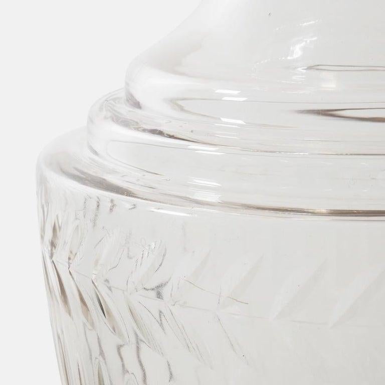 A large and impressive Edwardian cut glass pedestal apothecary jar.
Standing over two feet high this highly decorative jar date from circa 1910.
Composed of a tall lid with cut glass finial and ribbed decoration surmounting a fluted baluster body