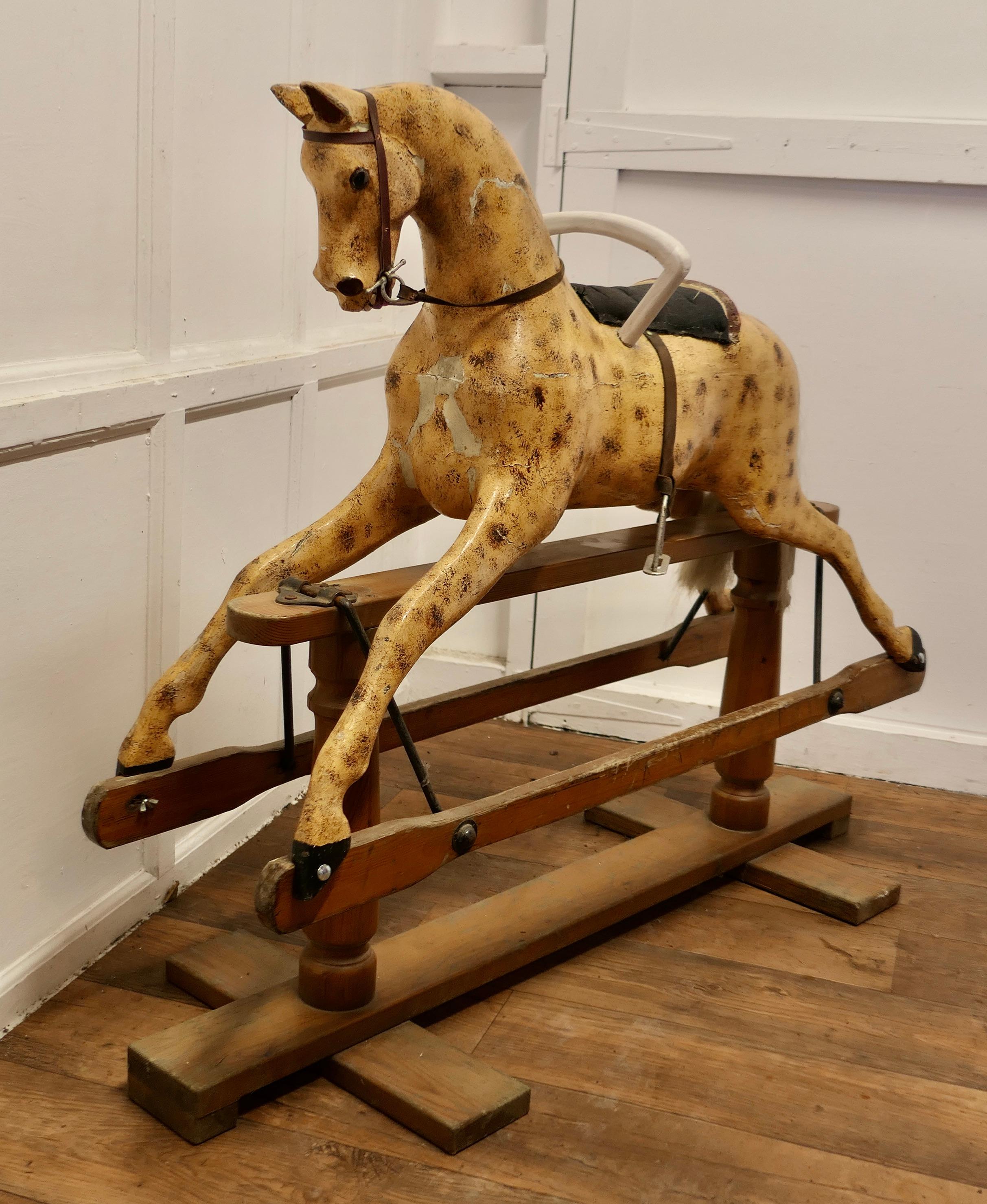 A Large Edwardian Rocking Horse

A handsome galloper, he has the classic open mouthed expression, glass eyes and an arched neck, his bridle is a bit moth eaten
Our fine animal has a good sound structure, he has had plenty of use over his life time