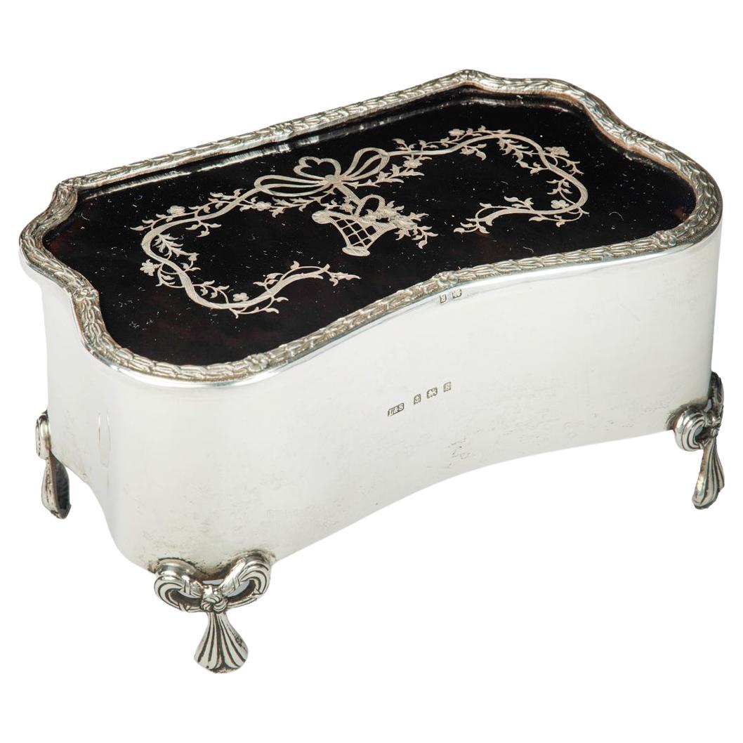 A large Edwardian shaped rectangular silver and tortoiseshell piqué box For Sale