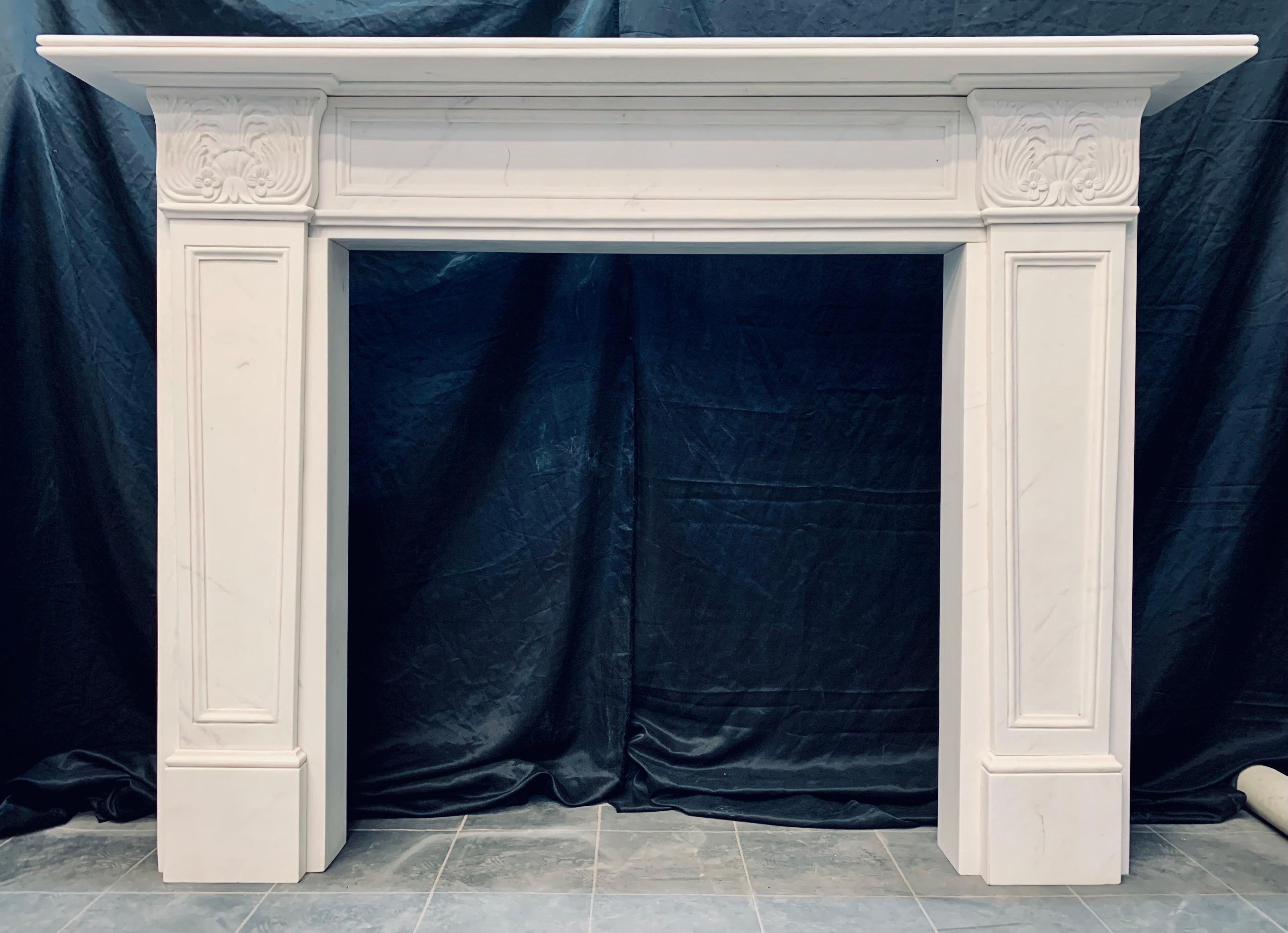 A large and handsome with good proportions-Egyptian revival manner lightly veined statuary marble fireplace surround. 
A generous top shelf with double bull nose moulding, a secondary convex under moulding all resting on a recessed and moulded