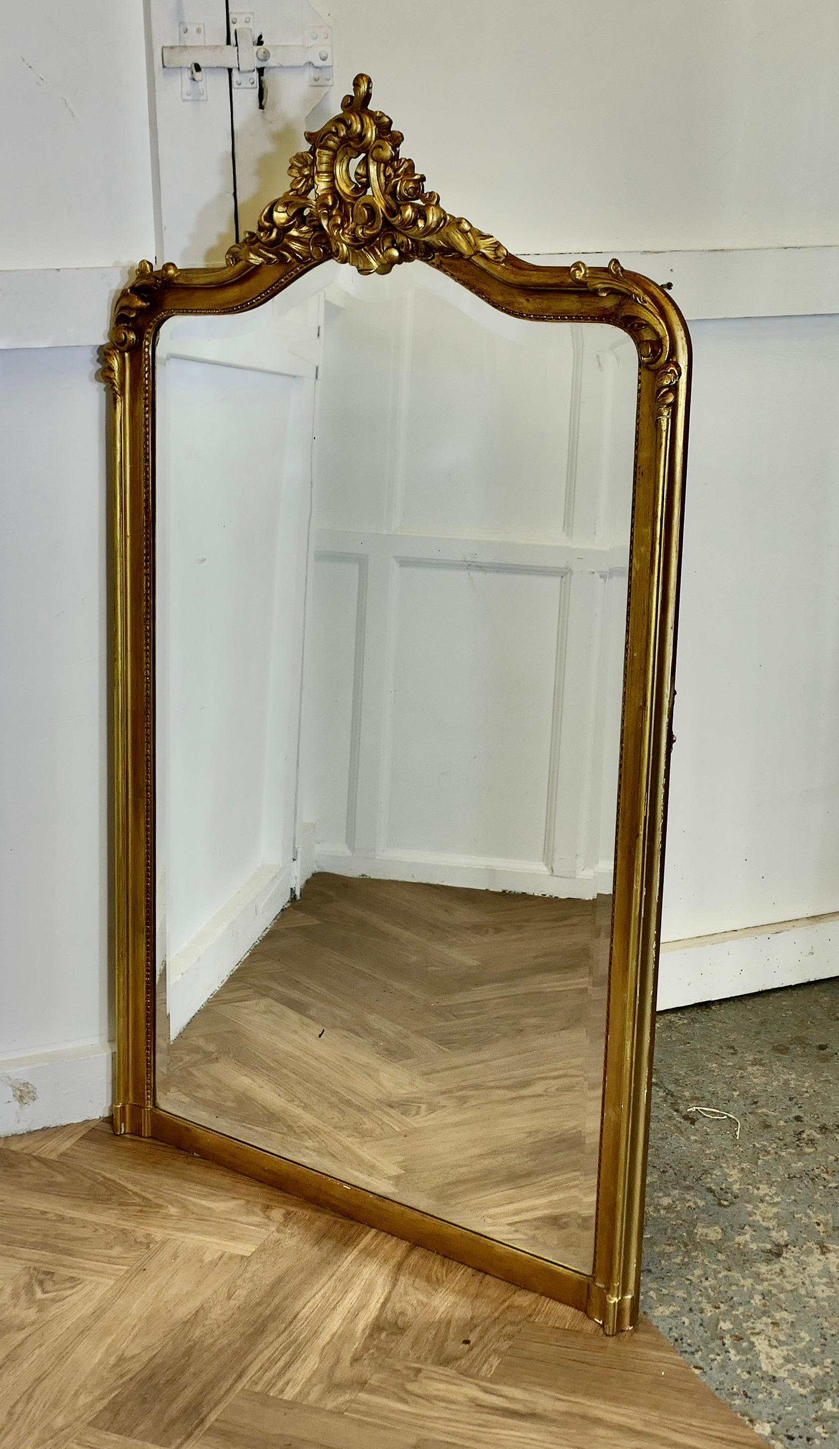 A Large Elaborate French Rococo Gilt Console Mirror Decorated with Leaves and Scrolls 

This is a superb ornate large Mirror it has a Gilt Wood Frame, it is made with carved wood and Gesso decorated with a large Scrolling Crest at the top, the