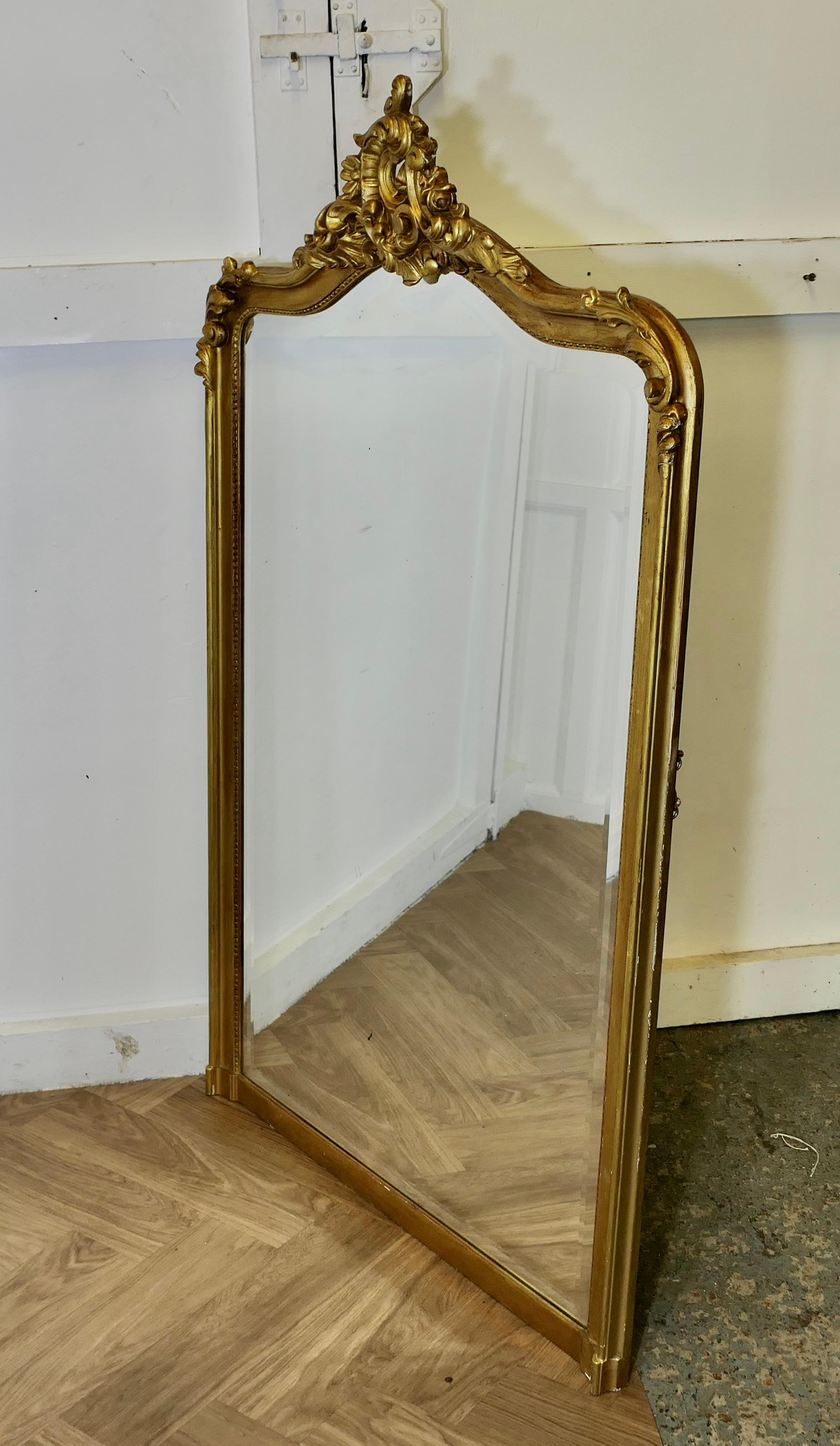 French Provincial A Large Elaborate French Rococo Gilt Console Mirror Decorated with Scrolls For Sale