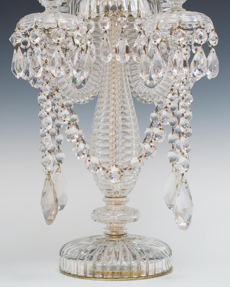 A large elaborately cut single candelabra by Perry & Co., London.