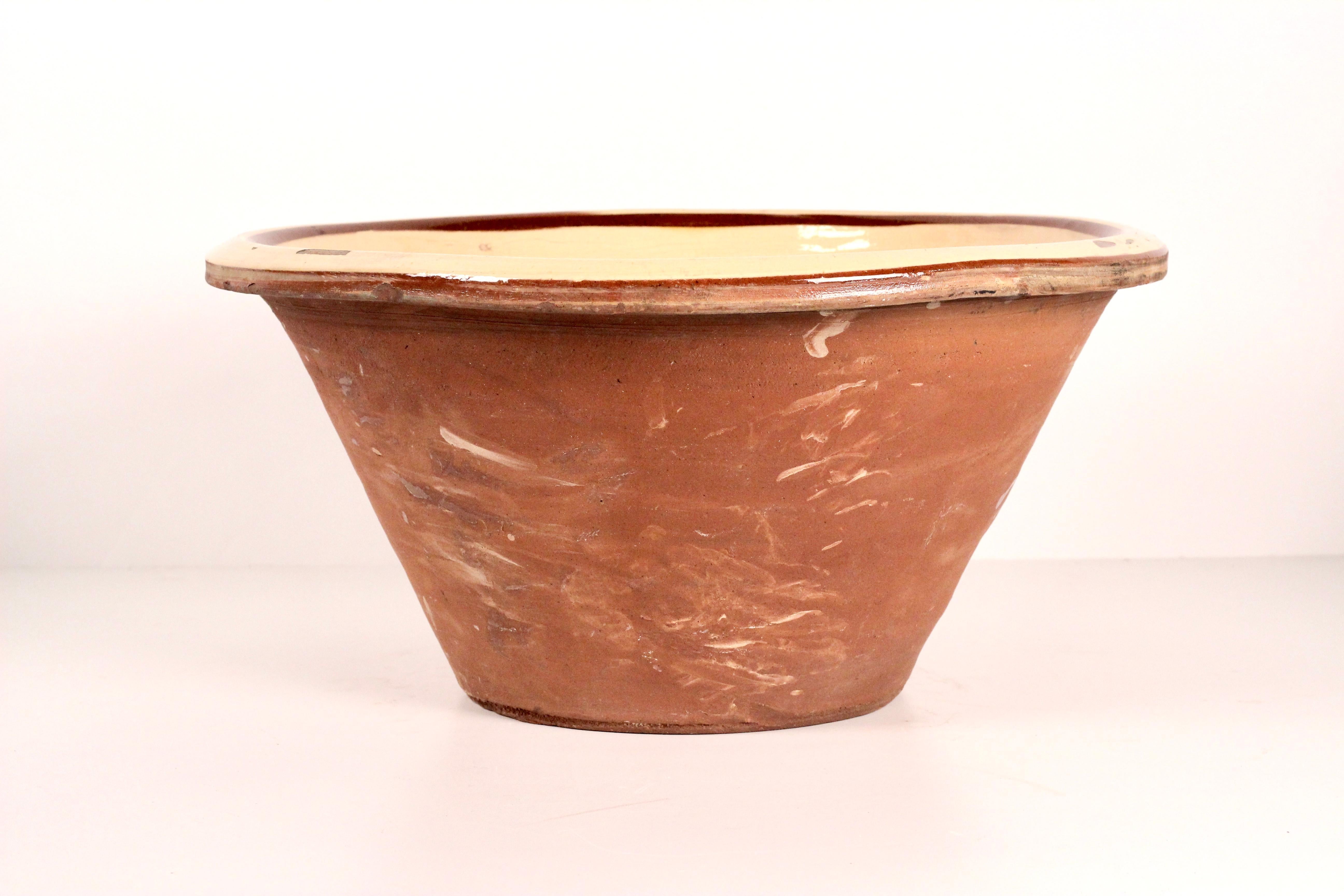 This wonderful over sized 19th Century Dairy Bowl was found in the darkest depths of The historic Cotswolds in England. A Hand made Dairy Bowl that we procured from a traditional cheese maker. It contains much character, showing years of patina and