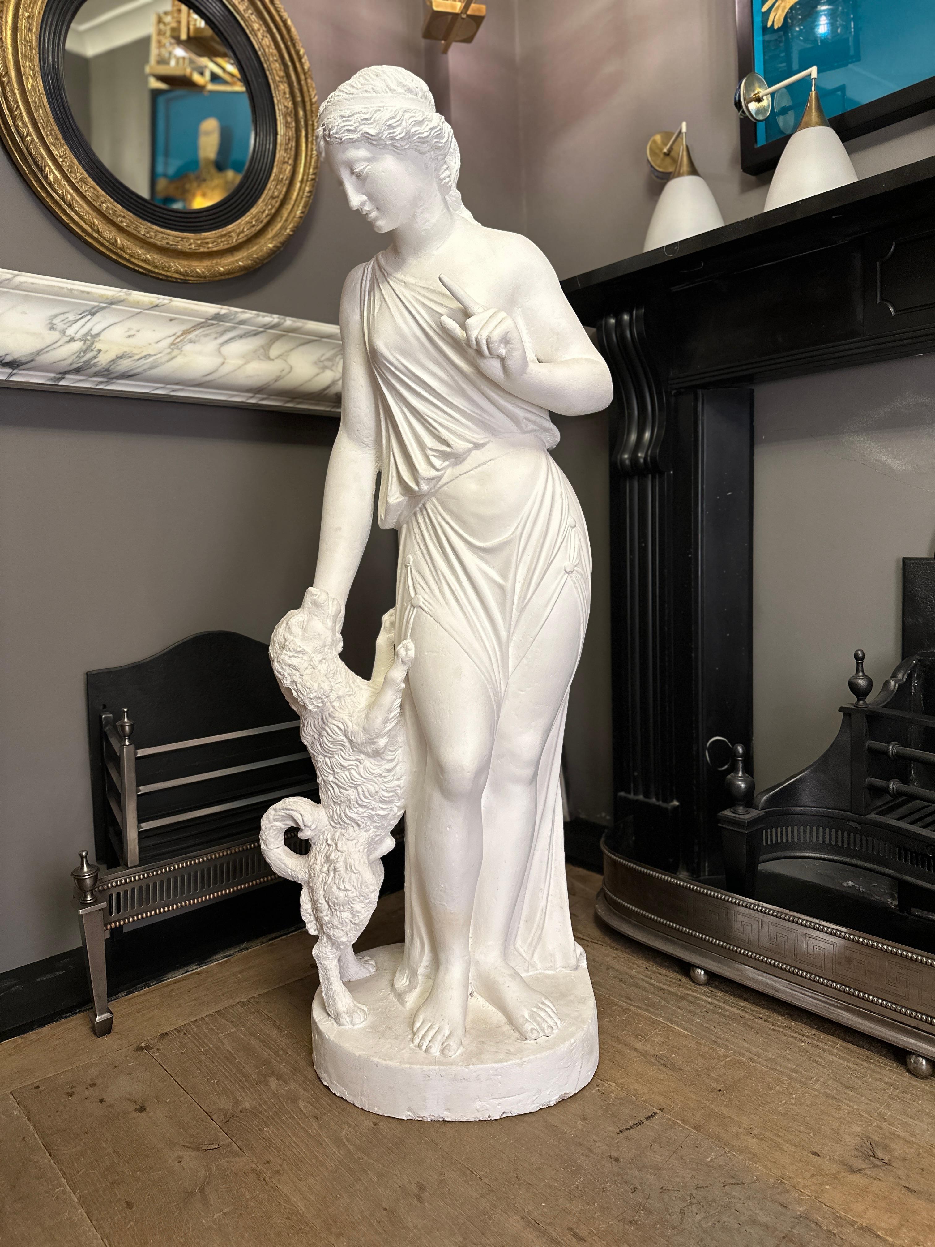 An almost 4.5ft tall Plaster Fidelity Statue from the English Regency/ Victorian period. Good form and scale with some Historic restoration over the years, however as seen in the images in fantastic condition. The female figure in classical dress