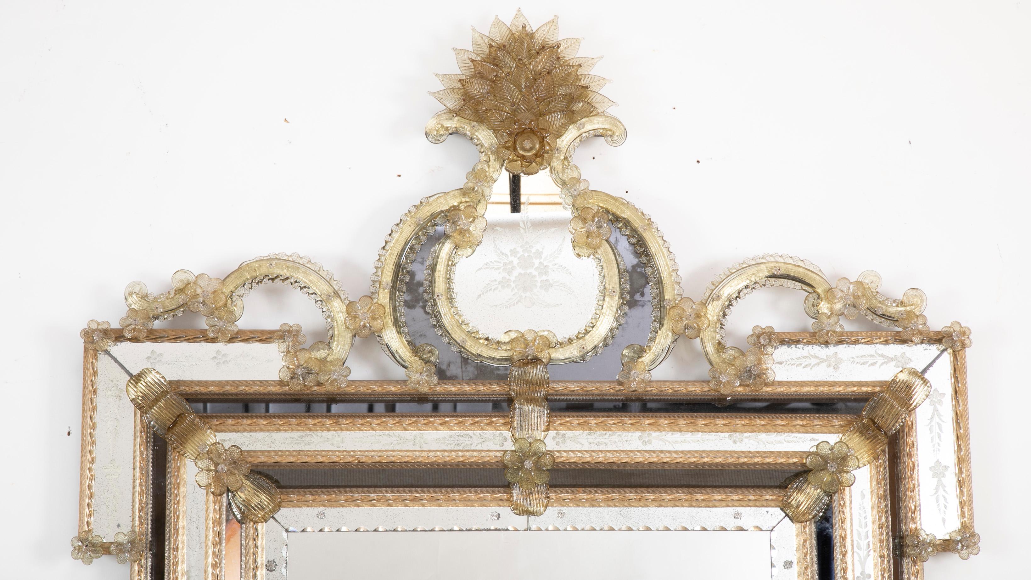 An impressive etched Venetian mirror with blown colored and clear glass flowers and rosettes and rods.