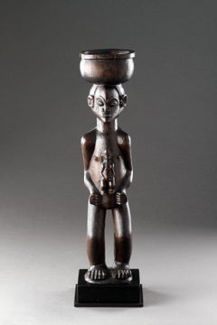 A Large Finely Carved ‘Cup Carrier’ of a Women with Child