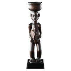 Antique A Large Finely Carved ‘Cup Carrier’ of a Women with Child