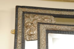 Large Flemish Ebonized Ripple Cushion Mirror with Silvered Decoration