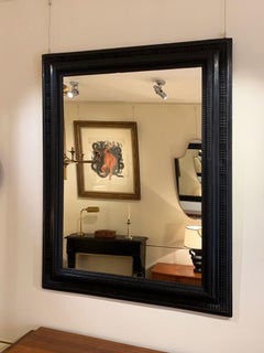 Large Flemish Style Carved and Ebonized Wood Ripple Frame Mirror