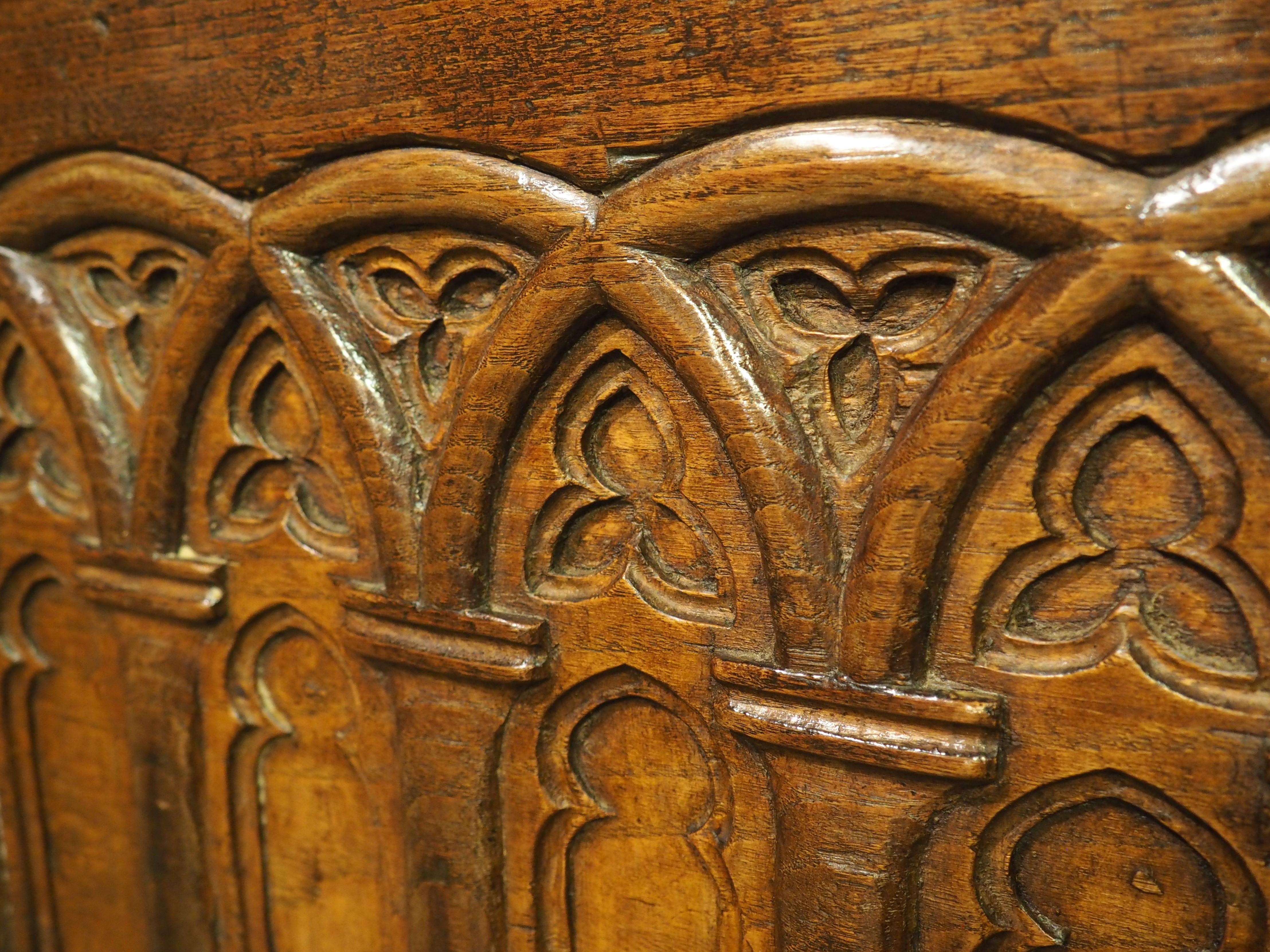 A Large French 17th Century Gothic Style Trunk in Carved Chestnut In Good Condition In Dallas, TX