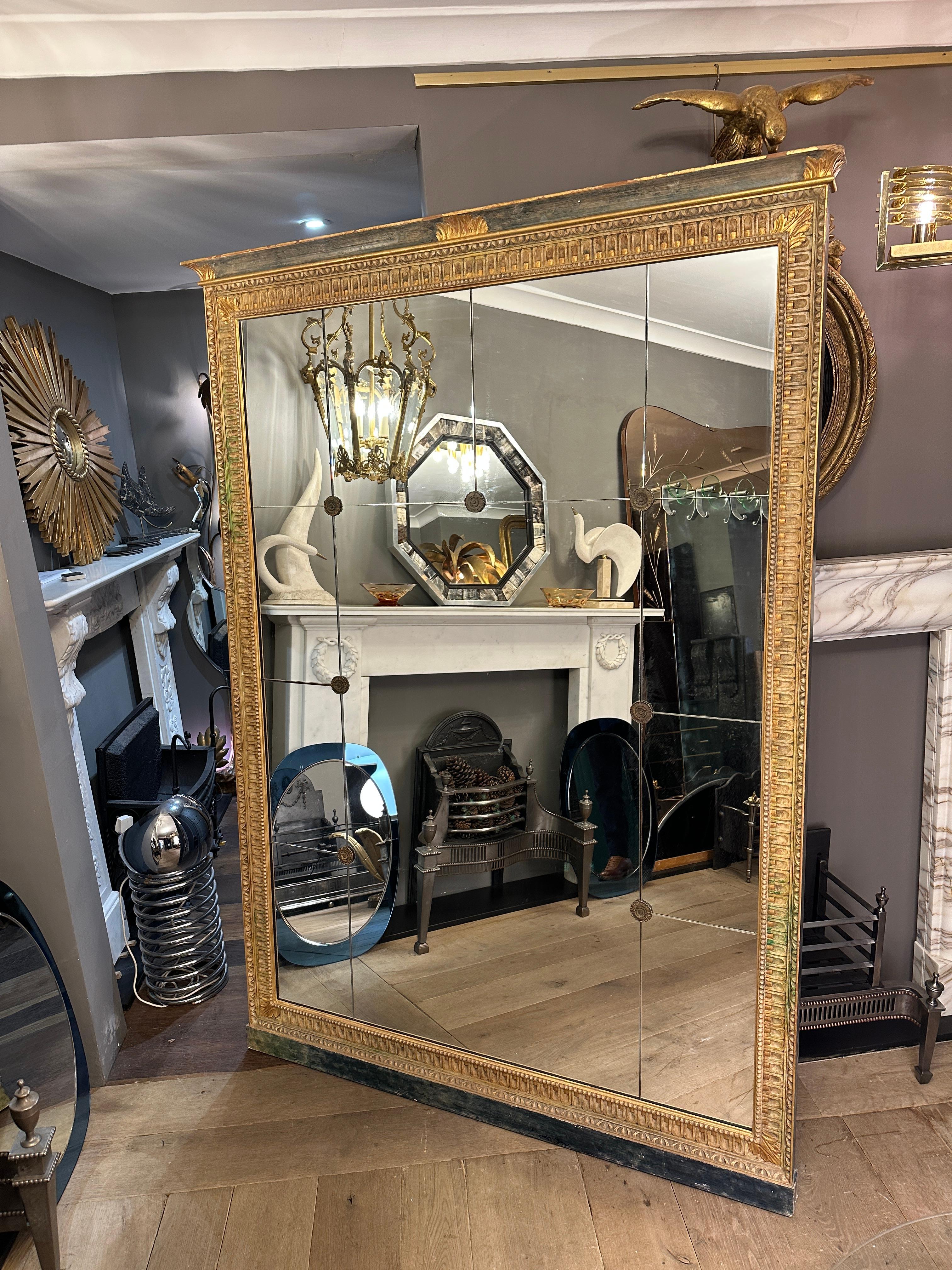 Giltwood A large French Antique Panelled Gold Gilt Mirror In The Empire Style 