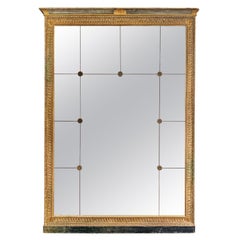 A large French Antique Panelled Gold Gilt Mirror In The Empire Style