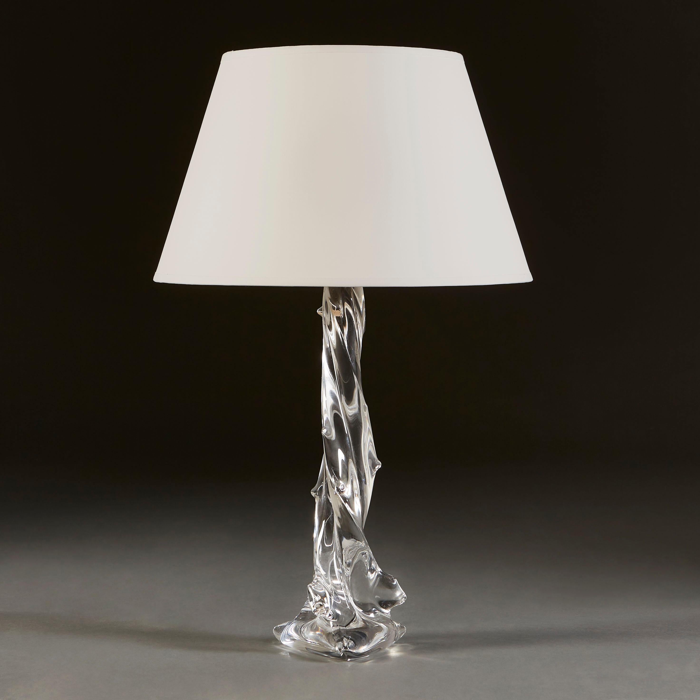 An unusual, large French art glass lamp, of irregular form with a triangular base, from which the glass twists upwards from the three outer points of the base, pulled into points along the upright. Attributed to Vannes.

Currently wired for the