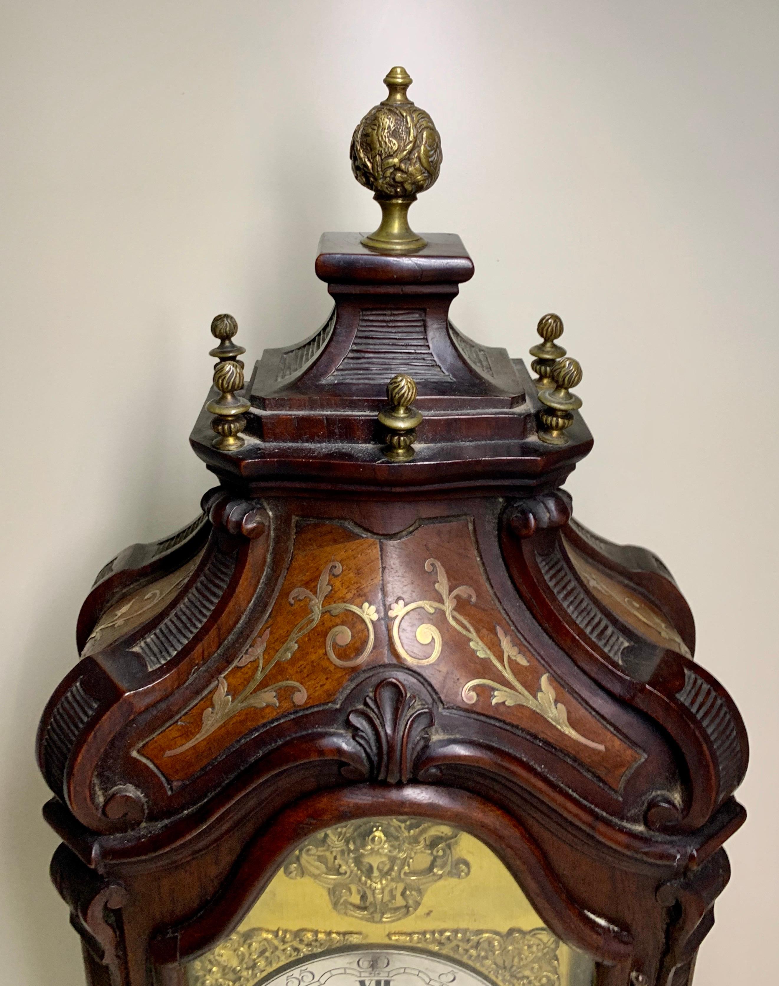 A nice striking mantel clock on stand made by Planchon A Paris.
The rich decorated case in dark Mahogany with gilt brass details looks just like boulle inlay.
The clock has a Silvered dial with Roman hour numerals, minute numbers and has the