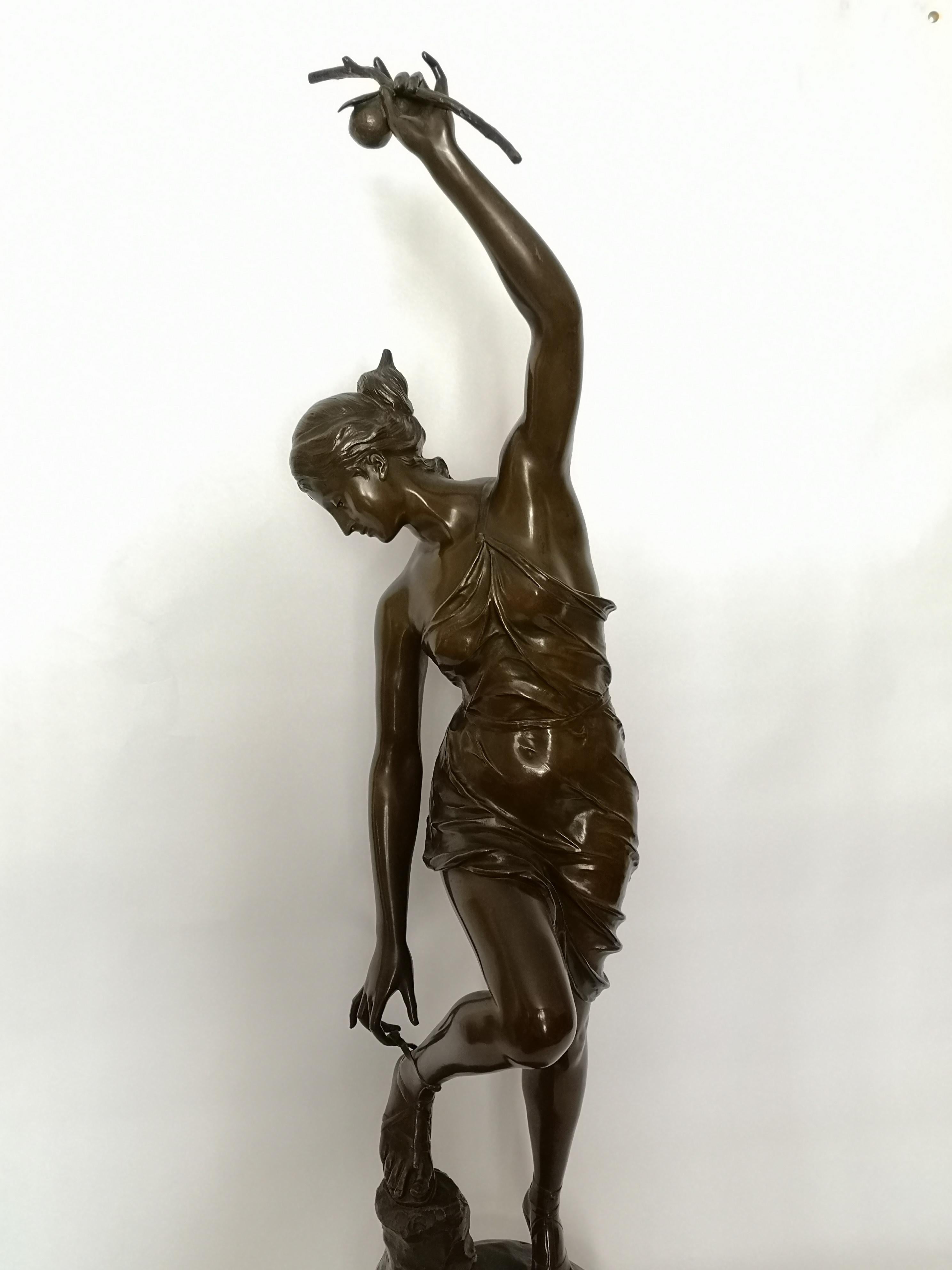 This large late 19th century French figure of Atlante is scantily dressed and holding a fruit high above her head with the opposite foot resting on a naturalistic base with more fruit.
Signed G. Saulo with a bronze plaque '2nd medal exhibition of
