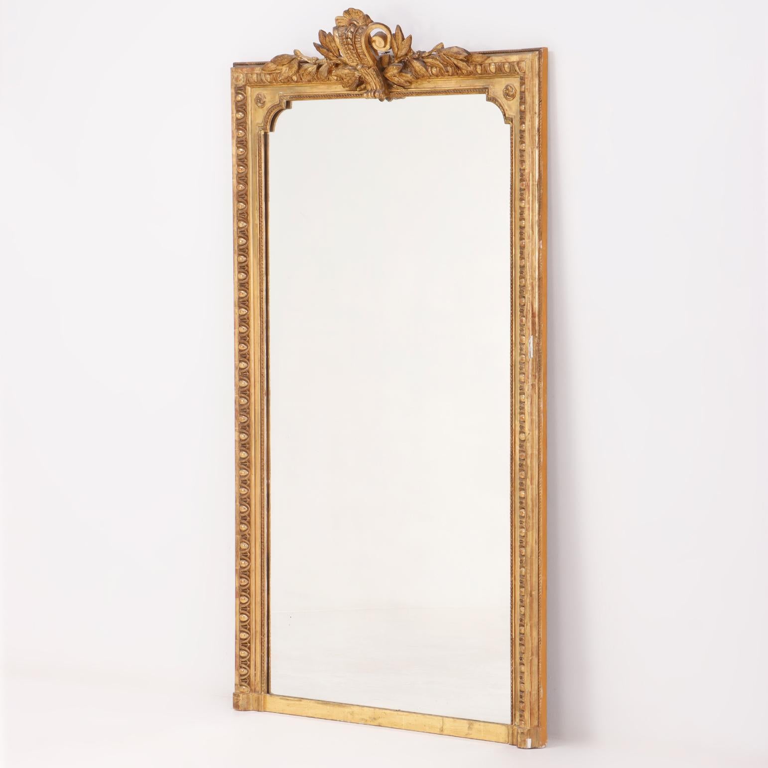 A large French giltwood and gessor mirror in the Louis XV style circa 1910.  In Good Condition For Sale In Philadelphia, PA