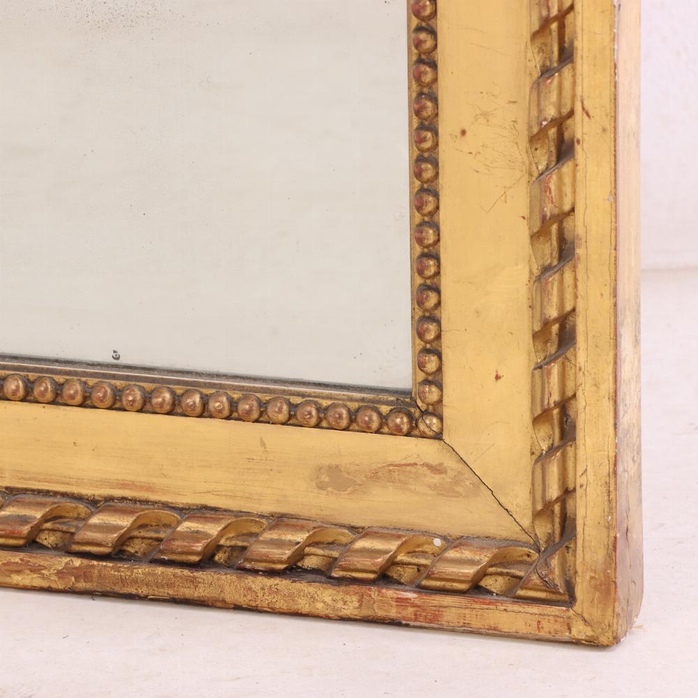 19th Century A large French giltwood mirror with ribbon crest, C. 1890. For Sale