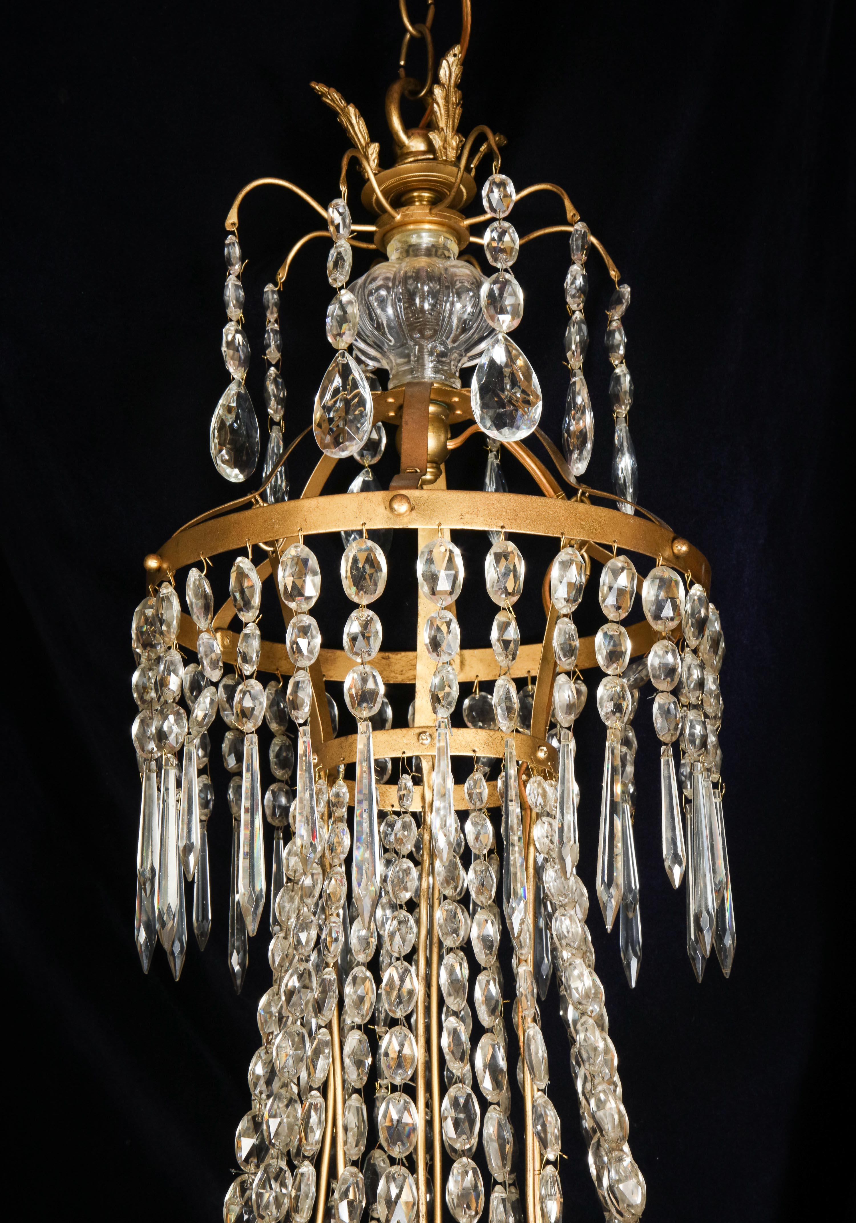A Large French Neoclassical Style Gilt Bronze and Crystal Chandelier For Sale 7