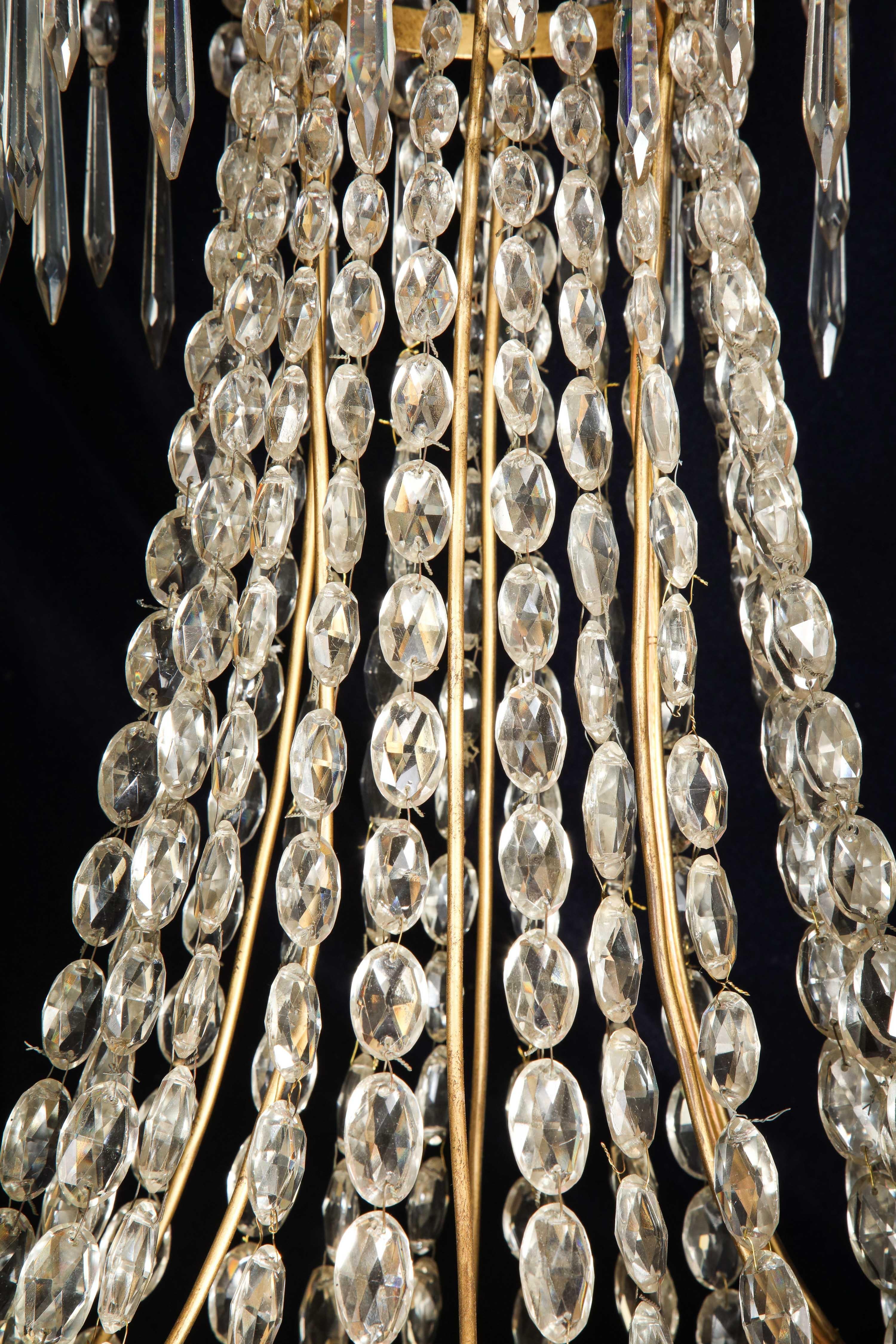 A Large French Neoclassical Style Gilt Bronze and Crystal Chandelier For Sale 8