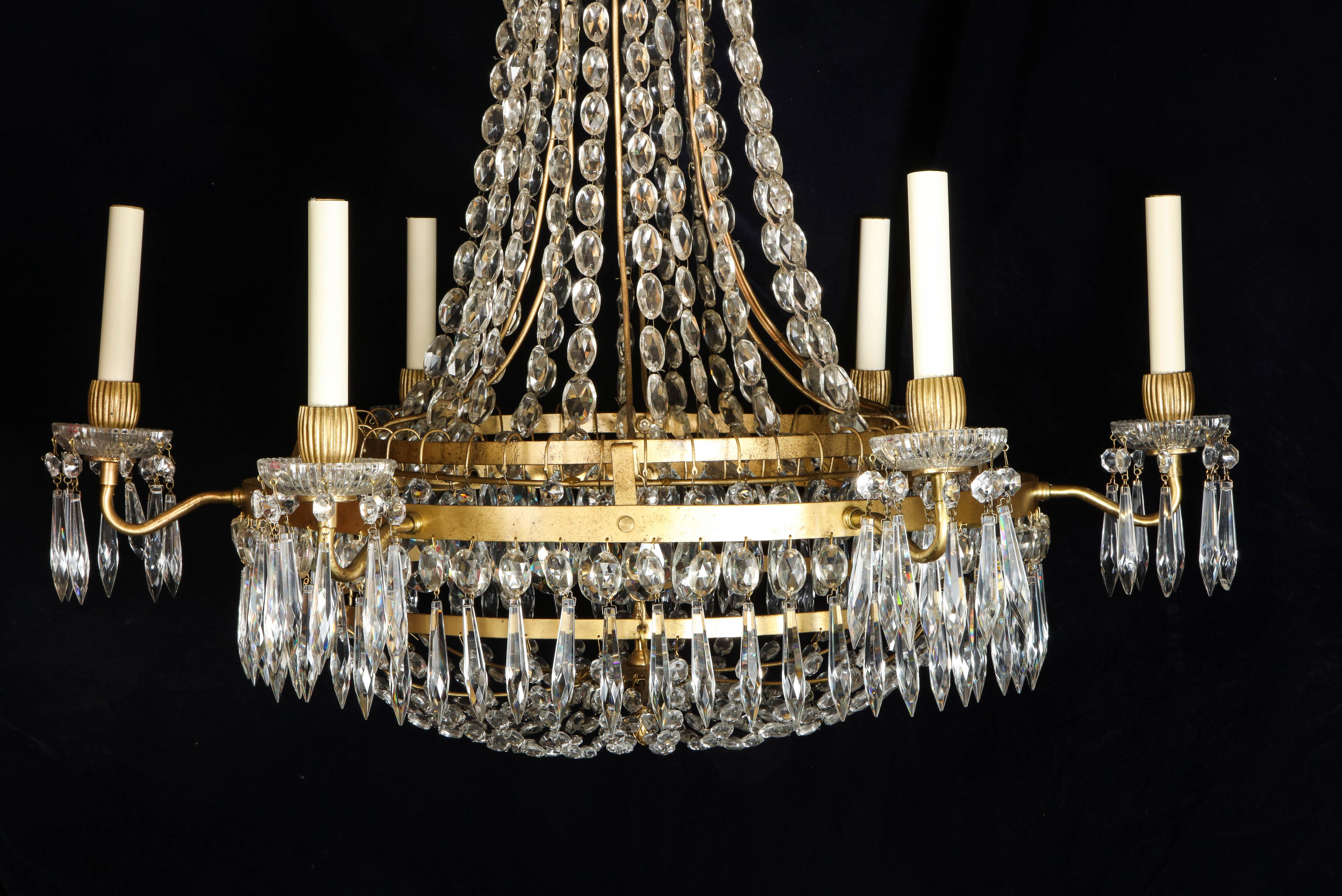 A Large French Neoclassical Style Gilt Bronze and Crystal Chandelier In Good Condition For Sale In New York, NY