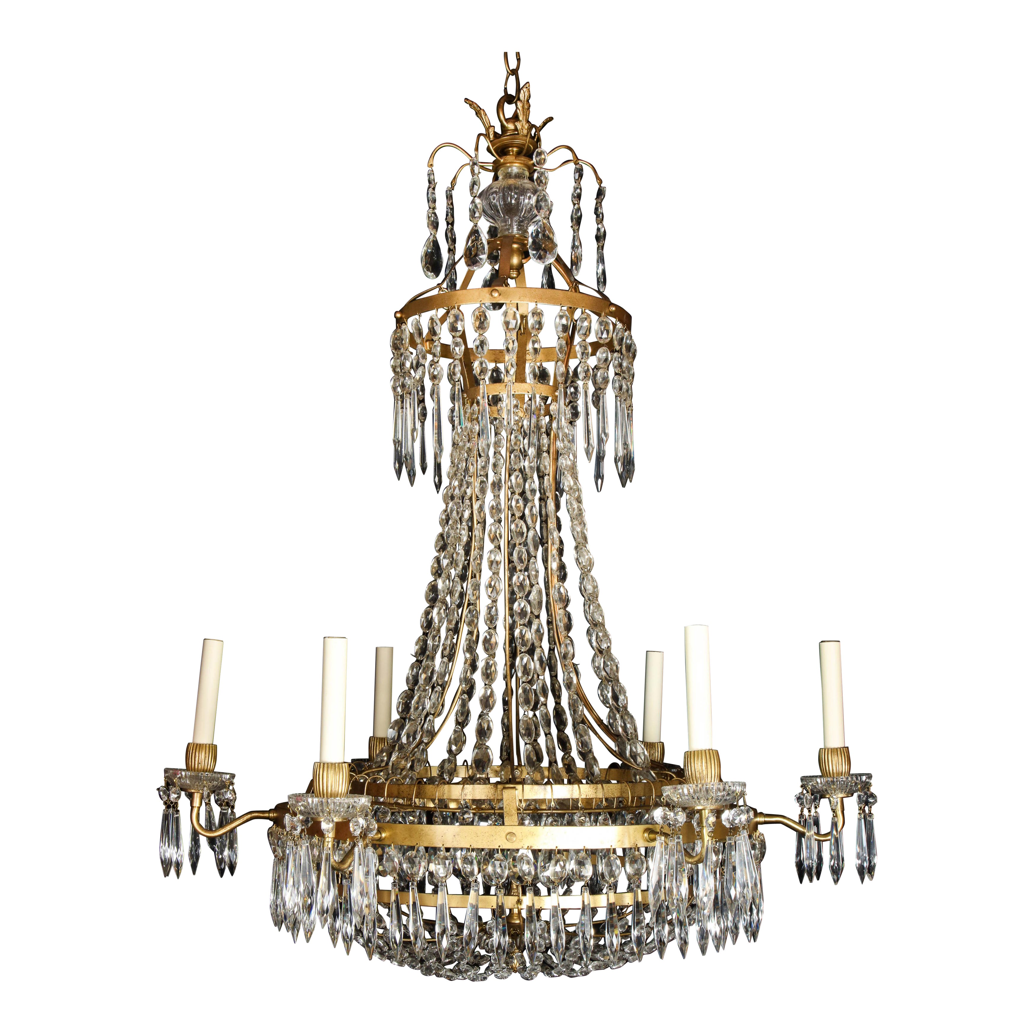 A Large French Neoclassical Style Gilt Bronze and Crystal Chandelier For Sale