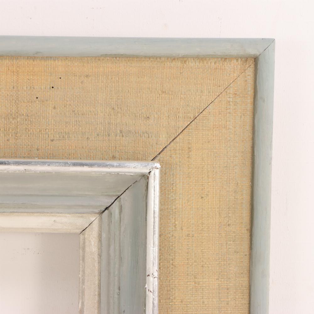 Adorned with grey paint and silver leaf, this frame would be great for the right painting or used as a mirror.
Interior opening: 37.75