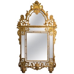 A Large French Regence-Period Carved Giltwood Mirror