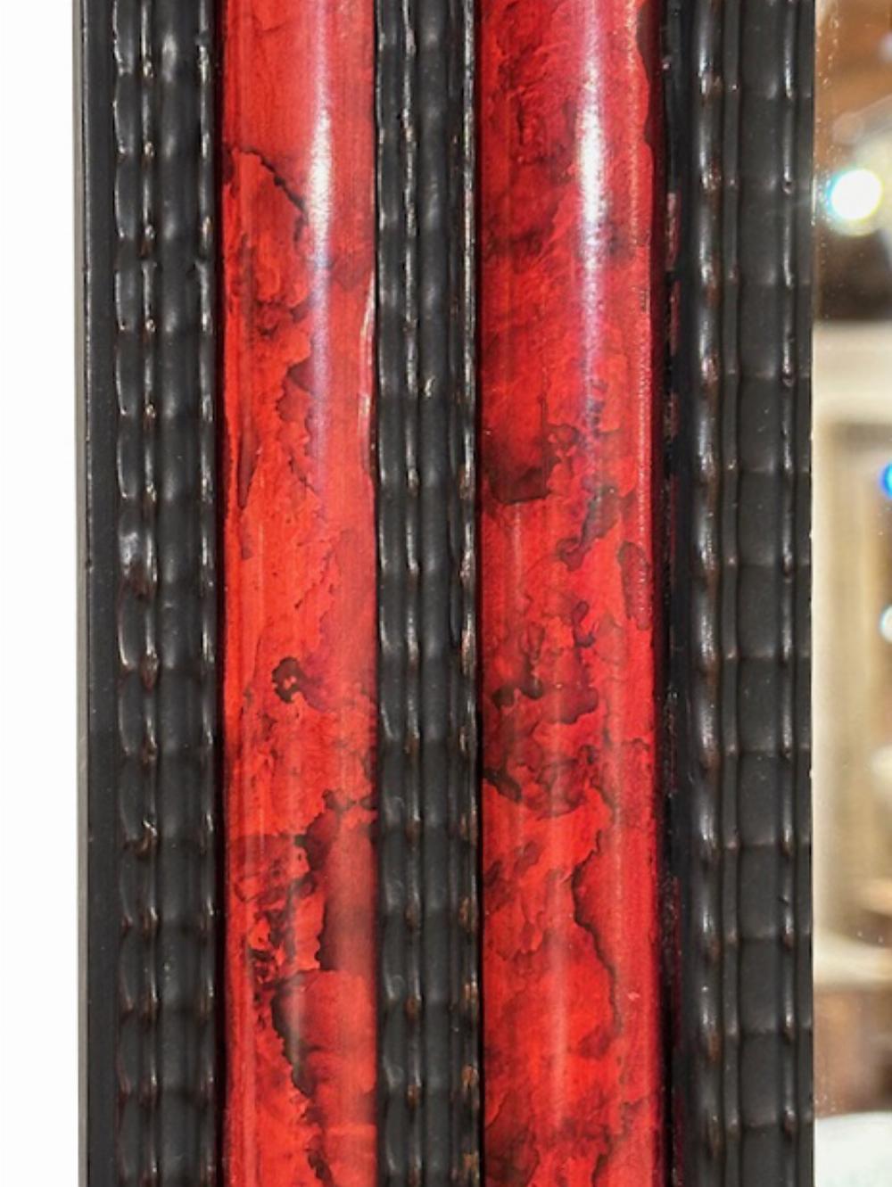 Mirror A large French ripple carved and faux tortoiseshell cushion mirror. For Sale