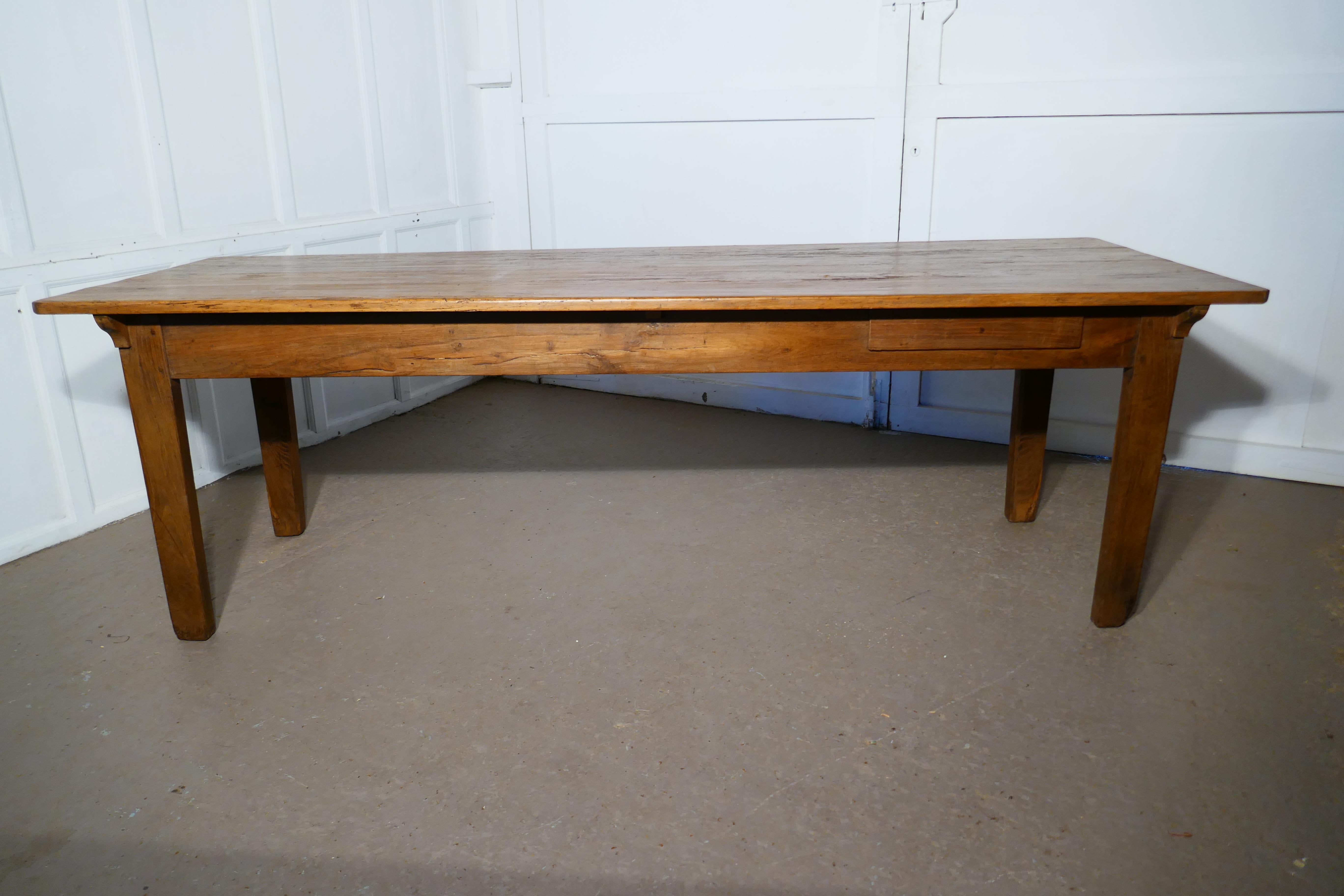 A Large French Rustic Pine table
 
This long Farmhouse table, it dates from around 1890 
The 4 plank pine table top is 1” thick, there is plenty of character to be seen on this piece providing you like the Rustic Look 
The table top has some