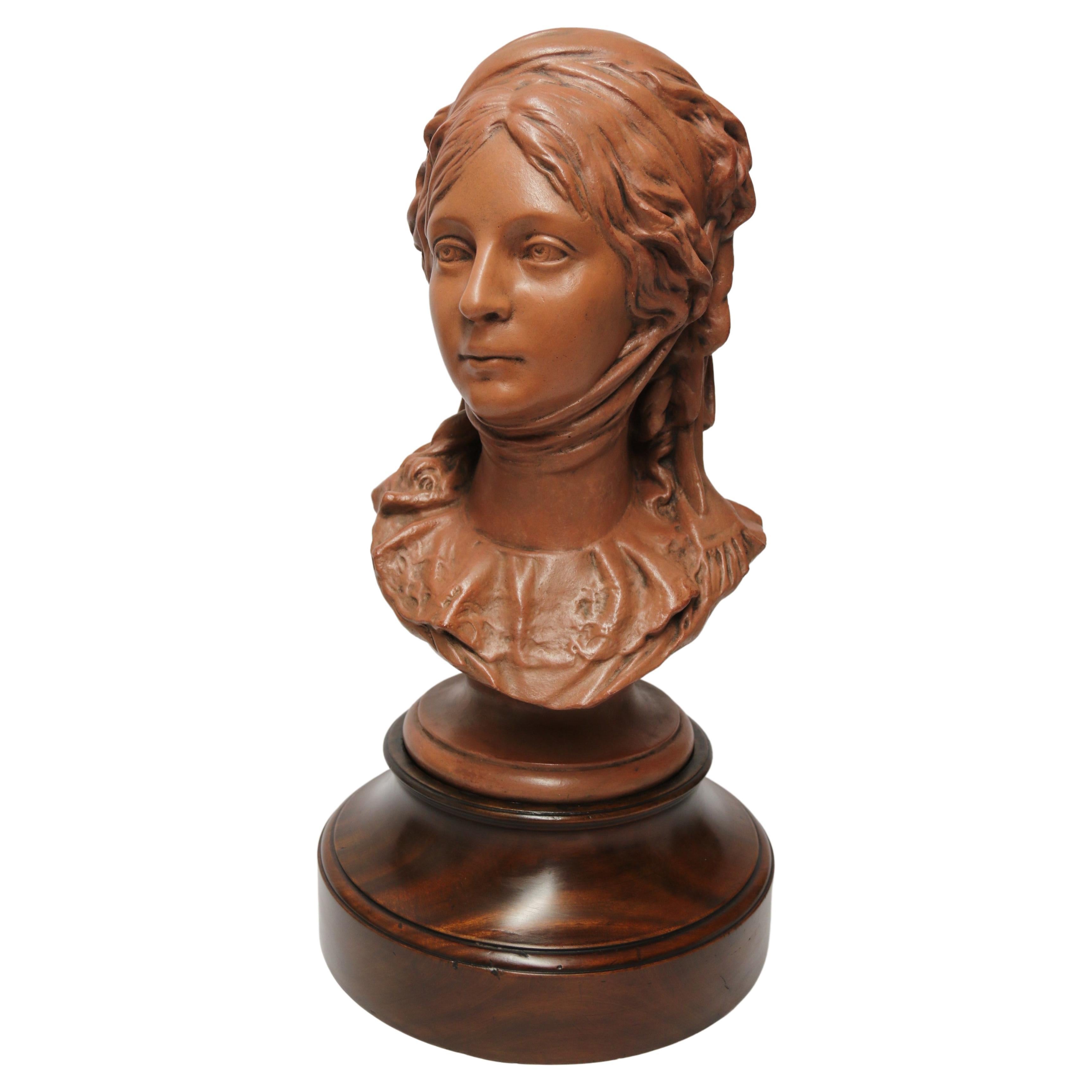 Large French terracotta bust of Queen Luise of Prussia on a stand, circa 1910